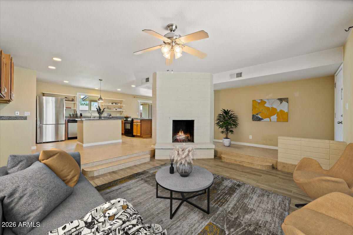 No HOA and plenty of room to park your RV, boat, work truck or any other toys!!!   Gorgeous single story home in the heart of Tempe with nearly a 1/4 acre corner lot and tons of curb appeal.  Upgrades include a newer A/C (7yrs)!!  Open concept kitchen is the centerpiece of the home and features granite counters, new cooktop, stainless steel appliances, custom shelving, large kitchen island, recessed lighting and a walk in pantry. You'll love the cozy wood burning fireplace in the family room.  Relax and enjoy a stunning AZ sunset from the beautiful backyard featuring low maintenance artificial grass, a covered patio and RV gate.  Other features include updated tile floors, ceiling fans in all bedrooms, North/South exposure and a newer washer/dryer.  Fantastic location and near the... park, golf course, freeways, stores, banks ,theaters and mall. Easy access to US60, I10, Sky Harbor Airport, ASU campus.  Don't miss this incredible opportunity!
