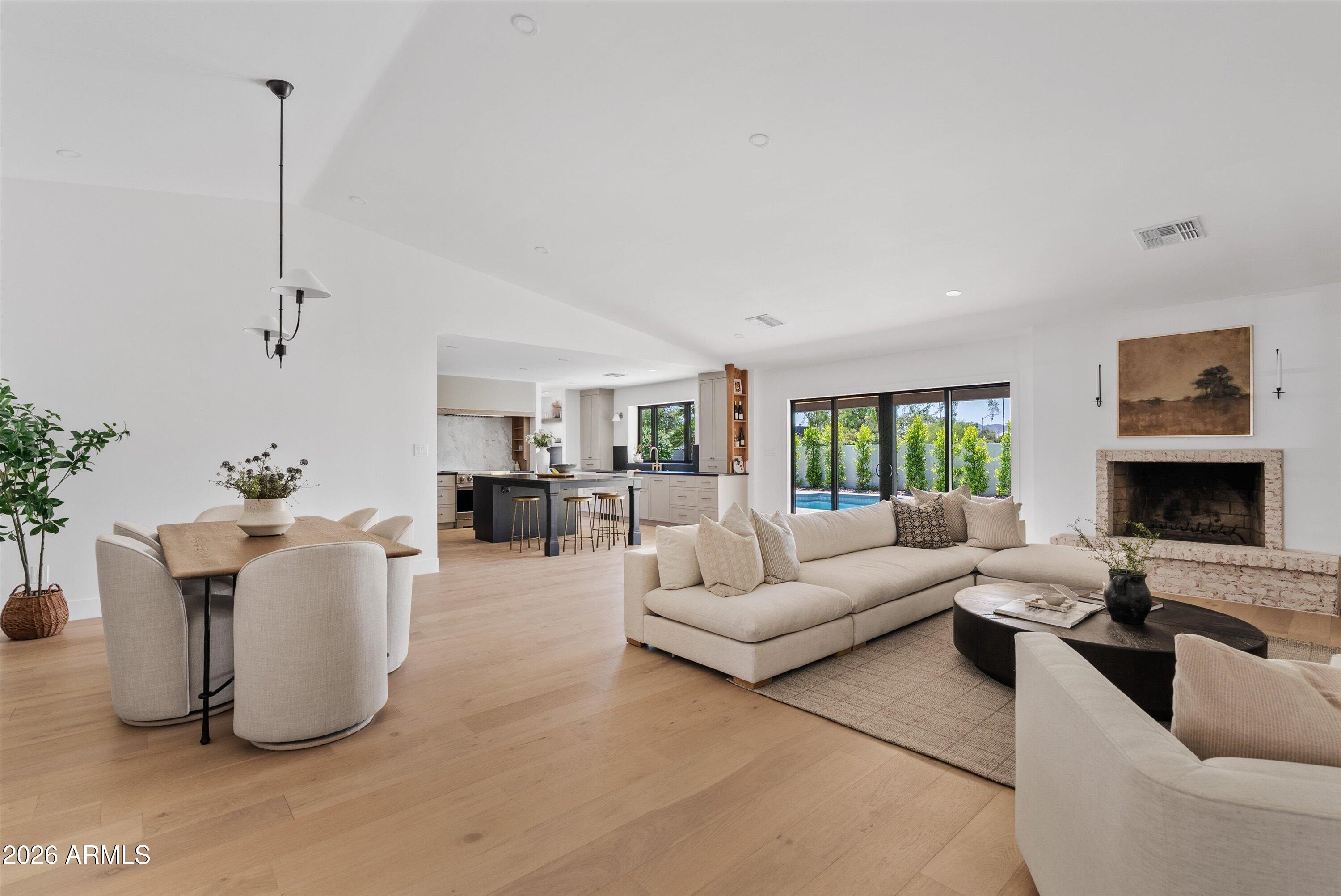Perfectly positioned near McCormick Ranch and Gainey Ranch, this fully reimagined Scottsdale residence delivers refined design, timeless finishes, and effortless indoor-outdoor living. Offering 4 bedrooms, 2.5 bathrooms, and a private office, every space has been thoughtfully curated with elevated designer touches throughout. The office features sliding glass doors opening to a tranquil front patio, creating the perfect work-from-home retreat or flex space.  At the heart of the home, expansive living and dining areas are filled with natural light and enhanced by a dramatic multi-slider that opens seamlessly to the covered patio for true Arizona-style entertaining. The chef's kitchen flows effortlessly into the main living spaces and is complemented by a spacious butler's pantry and functional drop zone, blending luxury with everyday convenience. Designer-selected quartzite countertops are carried throughout the home, while the primary suite offers a spa-inspired retreat featuring a stunning marble tile wet room and elevated finishes designed to evoke quiet luxury. Outside, enjoy a resort-style backyard complete with a sparkling pool, generous patio space, and a private setting ideal for relaxing or hosting guests. Located within the coveted Cochise, Cocopah, and Chaparral school boundaries and just minutes from Scottsdale's premier dining, golf, shopping, and resort amenities, this turnkey home offers the perfect balance of sophistication, comfort, and location.