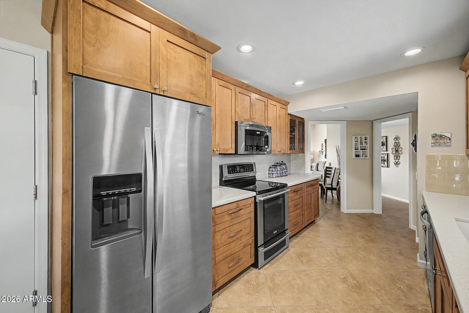 Your future is here! Simply Gorgeous!  2BR 2Ba Quad home offers all the updates you have been seeking!  Come and fall in love with the stunning remodeled kitchen with custom style cabinetry and newer appliances including an induction range! Updated baths with custom tile enclosures, newer windows, flooring, HVAC, roof, water heater, the list goes on! Private back patio for entertaining or relaxing, An exceptional amount of storage awaits in the oversize garage with storage room.  This absolutely immaculate home is located in the heart of Sun City! close to recreation centers, golfing and all amenities offerings an abundance of amenities close by for your new carefree lifestyle!  Please see supplement for home updates! Home Improvements and Regular Household Maintenance

10429 West Hutton Drive, Sun City, AZ 85351

2015 - Kitchen remodel, new floors throughout, ceiling fans installed in all rooms except
bathrooms, all interior walls and ceilings repainted, new bathroom vanities installed,
roof maintenance, patio pavers installed
2017 - Shower/tub inserts removed and showers upgraded to tile
2017 - Garage maintenance and improvements including plumbing and electrical upgrades
water heater replaced: RUUD 57 gallon installed; flushed yearly 2018 thru 2025
2018 - Energy audit/inspection around doors, windows and air ducts,
improvements made
2018 - Foam roof installed and guest bathroom skylight replaced by E&amp;J Roofing; inspected
2019 and 2021
2019 - Sliding doors in bedrooms replaced with windows
2021 - Garage door replaced by Smokey's Garage Door; lubrication on rollers, housing,
bearing plate and hinges twice yearly 2021 thru 2026
2022 - Elastomeric and granules applied to roof by Armored Roofing; inspected 2023 and
2026; another inspection suggested in 2 years (2028); (Armored Roofing estimated the
application would last up to 10 years from 2022 application.)
2022 - HVAC unit replaced by Arctic Fox
American Standard 4 ton 14 SEER Pkg HP
Model #4WCY5048A1000AD
Serial #214711618L
System tuneup performed by Arctic Fox yearly 2021 thru 2025

HOA will be performing exterior painting in 2027, please see details in documents!