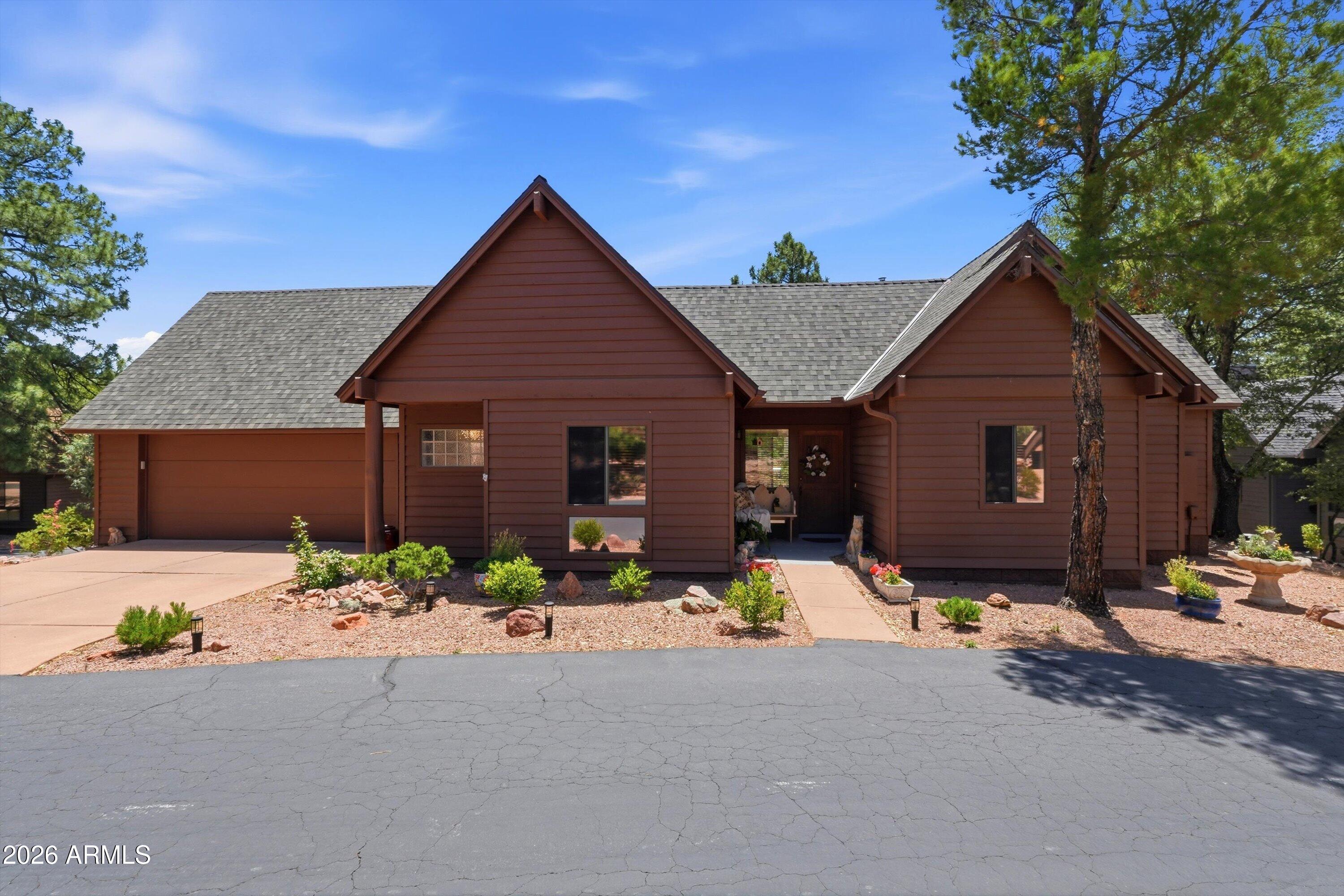 Escape the desert heat and discover your own mountain retreat in the heart of Payson. Nestled among the towering pines of the prestigious guard-gated Chaparral Pines community, this beautifully maintained 2-bedroom, 2-bath home offers 1,364 square feet of inviting single-level living designed for comfort, relaxation, and easy mountain living.

Often enjoying temperatures approximately 15 degrees cooler than the Valley, this property is the perfect full-time residence, seasonal getaway, or lock-and-leave escape from the Phoenix heat. Inside, soaring vaulted ceilings, expansive windows, abundant natural light, and a dramatic floor-to-ceiling stone fireplace with Quadra-fire pellet stove (2023 )create a warm and welcoming atmosphere with true mountain-lodge character. The open-concept living and dining spaces flow seamlessly into the kitchen, creating an ideal layout for entertaining or quiet evenings at home. Step outside to peaceful stone patios surrounded by mature pines, mountain air, and tranquil natural landscaping, perfect for morning coffee, evening wine, or simply unplugging and reconnecting with nature.

Located near golf, hiking trails, fishing lakes, and all the outdoor recreation Rim Country is known for, this home offers the ideal blend of serenity, lifestyle, and convenience within one of Payson's most sought-after communities.