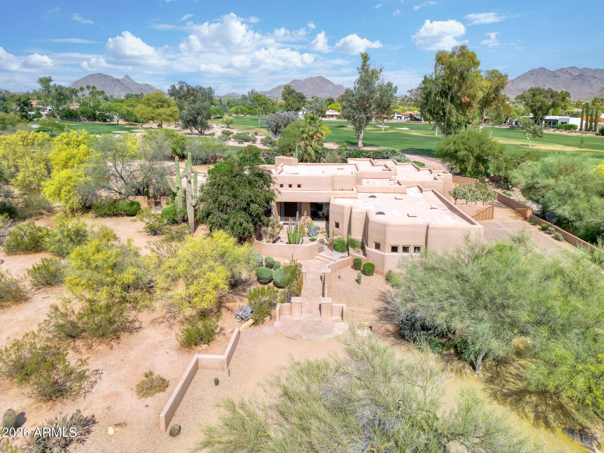Experience luxury desert living in this stunning estate nestled within a private gated community on the 3rd tee box of Pinnacle Peak Country Club. Situated on 1.67 acres of beautifully landscaped private grounds, this expansive residence offers a total of over 5,000 square feet of refined living space featuring 5 spacious bedrooms, 5.5 bathrooms, and a dedicated office perfect for working from home or a private study.

Designed for both comfort and entertaining, the home boasts a show-stopping gourmet kitchen featured in Phoenix Home & Garden Magazine complete with high-end finishes and large island. The thoughtful floor plan seamlessly blends elegance and functionality throughout. Step outside to your own secluded resort-style backyard, where privacy and tranquility abound. Enjoy the sparkling pool with dual waterfalls, a relaxing spa, outdoor grill, and multiple fireplaces that create the perfect ambiance for evening gatherings under the stars. A detached guest house with separate living room and kitchenette provides ideal accommodations for visitors or multigenerational living.

Additional highlights include a 4-car garage, RV parking and charger, generous living spaces and breathtaking golf course and mountain views. This is a rare opportunity to own a premier property that combines luxury, privacy, and an unbeatable location.