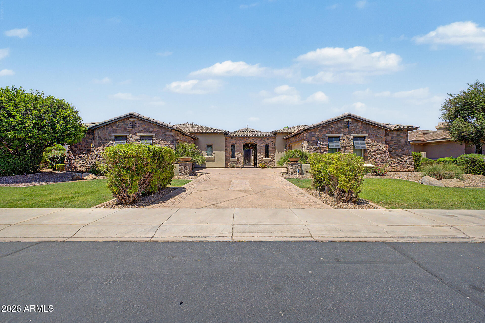 Welcome to the Valencia Gated Community! This stunning single-level luxury home offers the perfect blend of style and comfort. Designed for both relaxation and entertaining, the home features a spacious backyard with an inviting pool with a spacious, resort-style backyard experience located on the greenbelt with great views. Inside, you'll find a thoughtfully designed open floor plan with elegant finishes and spacious living areas. The private, gated community provides a peaceful and secure environment, with beautifully landscaped common areas and scenic walking paths. Conveniently located near top shopping, dining, and entertainment, this home offers the ultimate Arizona lifestyle. Don't miss your chance to own a piece of paradise!