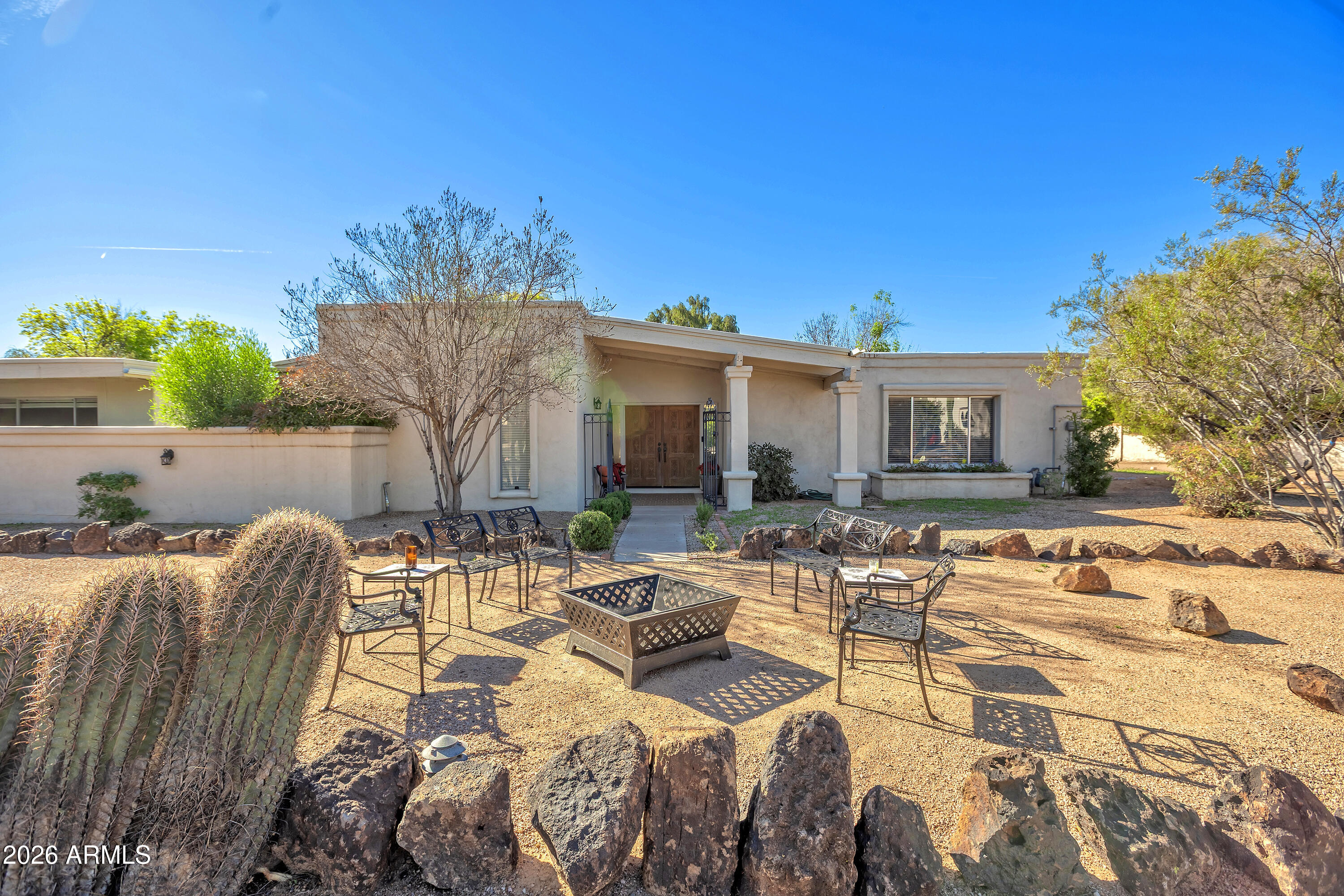 Also for Lease. Lovely light & bright , extremely clean, 4 bedroom, 2.5 bath home on .94 acre in the heart of Scottsdale near Lincoln & Scottsdale Roads.  Open kitchen w/ granite counter tops & stainless steel appliances. Lots of natural light through the large glass doors & windows opening to the large private patio, back yard with pool.  Primary Bedroom suite split with attached office or 4th bedroom.
Family room w/ fireplace. Covered 2 car carport attached to home with storage rooms.  Close to everything Scottsdale has to offer! Walking distance to Hilton Shopping center & so much more! Dogs welcomed upon approval of landlord. New Roof & New AC!. Lease Purchase Option and Seller Carry Back will be considered under right terms.