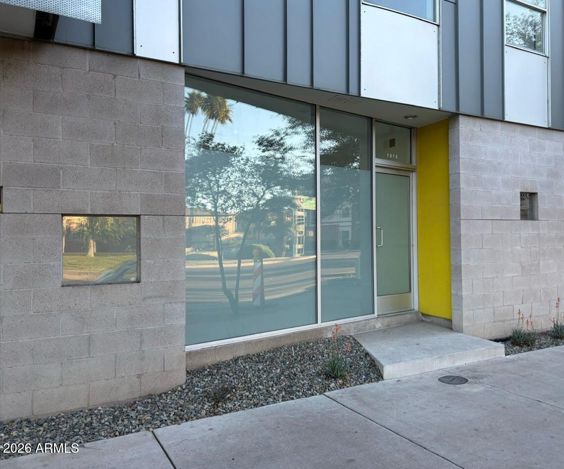 Back on market at no fault to property - previous buyer could not perform. Don't miss this exceptional, modern live/work condo featuring a large retail/commercial storefront in the front and a private residential retreat in the back. The living space offers an open floor plan with beautiful wood tile, new LVP flooring in the bedroom and office, and a spacious kitchen with stainless steel appliances. Located in a secure, gated community with underground garage parking, top-tier amenities include a pool, fitness center, spa, and walking paths. Unbeatable location near ASU, Mill Ave, the 101, and the Light Rail!