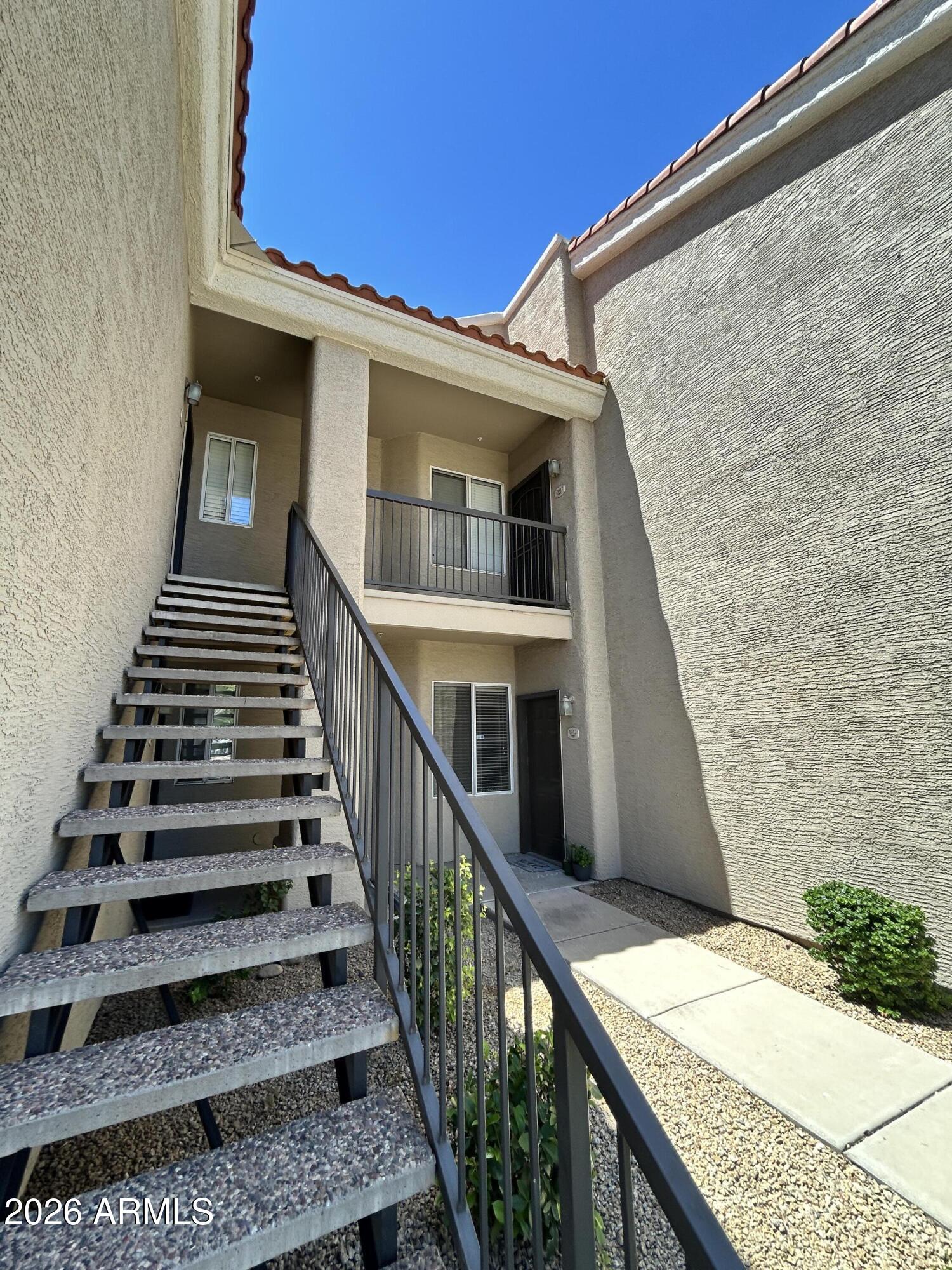 2ND STORY UNIT BOASTS A GORGEOUS GAS FIREPLACE, VINYL & TILE FLOORING, LED MIRRORS IN BOTH BATHROOMS, UPGRADED FANS, STAINLESS STEEL FARMERS SINK IN KITCHEN AND A PRIVATE BALCONY!! YOUR CLIENTS WON'T BE DISAPPOINTED WITH THIS UNIT! LIGHT, OPEN UNIT HAS GREAT ROOM CONCEPT, CLOCK ON THE WALL STAYS AS WELL AS THE TV WALL MOUNTS!  2ND BEDROOM HAS MIRRORED CLOSED DOORS, INSIDE LAUNDRY INCLUDES WASHER AND DRYER, MASTER BEDROOM HAS WALK IN CLOSET AND IT'S OWN EXIT TO THE BALCONY, MASTER BATH HAS WALK IN SHOWER.  CLOSE TO THE COMMUNITY POOL AND SPA! CLOSE TO THE LOOP 101 AND I-17, SHOPPING, ENTERTAINMENT AND MORE! SMALL PETS UP TO 35LBS ALLOWED WITH A PET DEPOSIT.