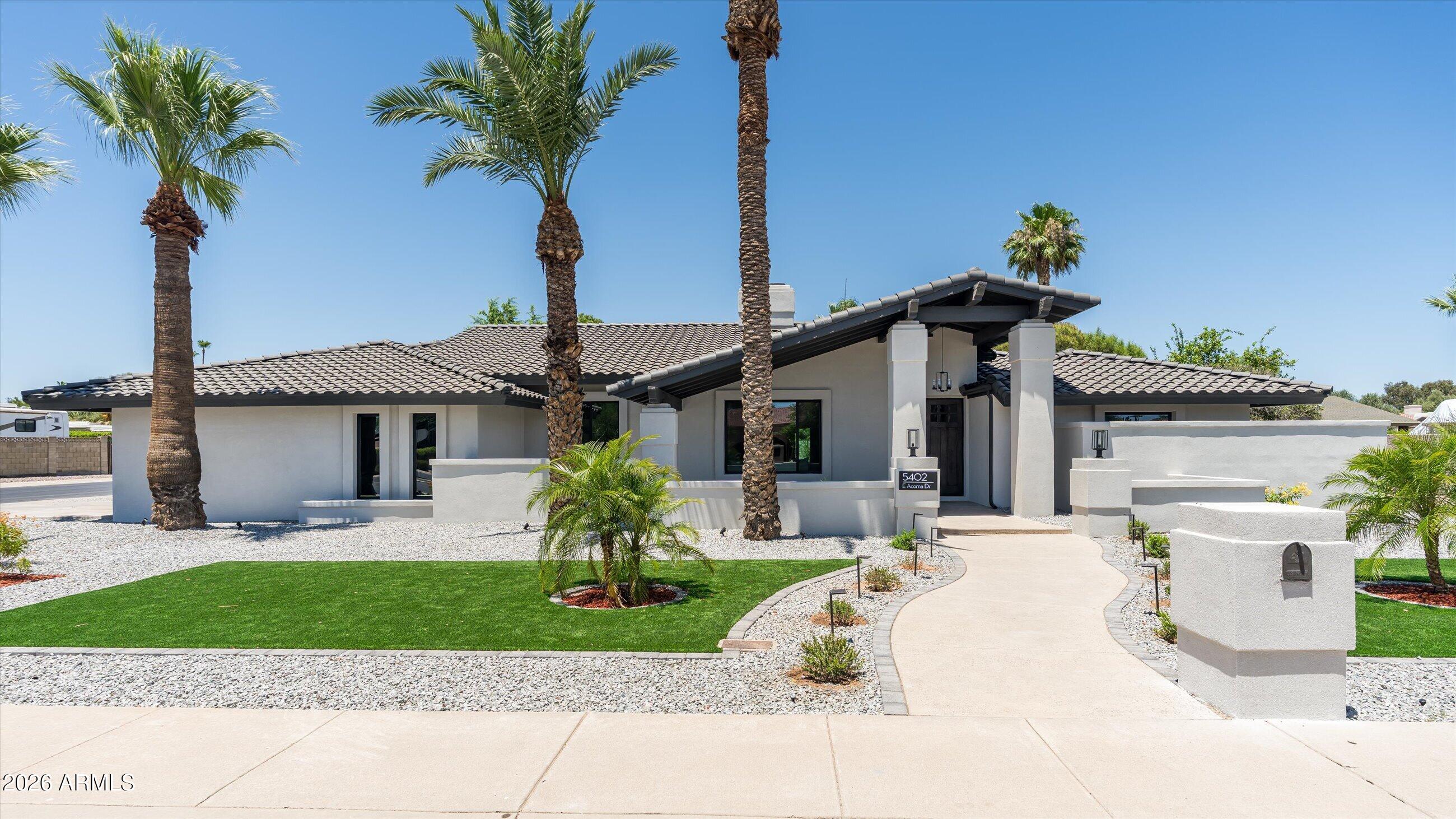 Fully remodeled with high-end finishes, this stunning 4 bedroom + office, 3 bath home offers the perfect blend of luxury and functionality. Soaring ceilings and a desirable split floor plan create an open, spacious feel throughout. The Primary suite has an exercise room attached and a spa -like bathroom. Situated on nearly 1/3 of an acre with RV gate, the backyard is an entertainer's dream featuring a newly surfaced pool and built-in outdoor grill. With no HOA, you'll enjoy added flexibility and freedom. Located in the highly sought-after 85254 zip code, this exceptional property is just minutes from premier shopping, dining, entertainment, and top amenities. A rare opportunity to own a turnkey home in one of the area's most desirable neighborhoods.