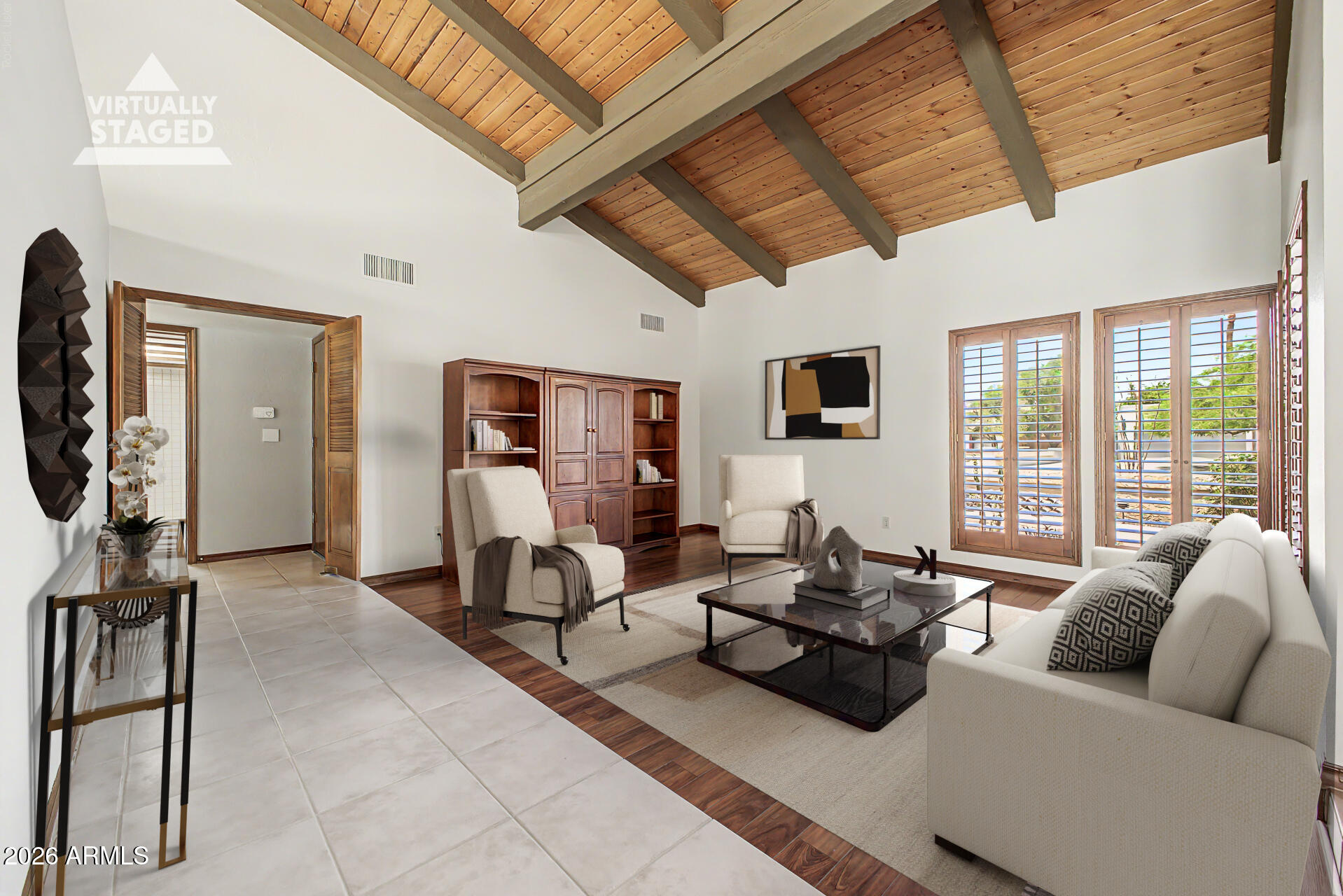 Rare semi-custom 6-bedroom South Tempe home with guest wing, owned solar, 3,870sqft on a 1/3-acre lot in desirable Round Valley Estates. Ideal for work-from-home and multi-generational living, this home features soaring wood ceilings, new dual HVAC systems, diving pool, RV gate, and low electric bills with grandfathered SRP metering. No HOA. Extremely well maintained & move-in-ready! Large kitchen features abundant cabinetry, ample counters, induction cooktop & Subzero fridge. Walk out back on over 14,000sqft lot to a beautiful pool & grass backyard. Entertain on the expansive patio & take advantage of the productive citrus trees. Welcome guests through a magnificent custom iron entry door accented with translucent venting glass that makes the foyer bright with natural lighting and opens to allow cool-weather breezes inside. Your eyes are immediately drawn upward to the magnificent natural wood cathedral ceiling, where rich warm tones and soaring architecture create an unforgettable sense of openness and character. Seven clerestory windows line the upper walls, allowing soft natural sunlight to cascade throughout the dining room and kitchen. 

The heart of the home is a light-filled expansive & large kitchen complete with extensive oak cabinetry, expansive counters, and an inviting open-concept design that anchors the main living spaces. The kitchen windows provide views of the entire pool, back patio, and grass area. Clerestory windows above not only flood the home with natural light, but also offer a rare opportunity to enjoy glowing views of the moon from the kitchen during certain times of the year. The flowing floor plan creates easy connectivity between the kitchen, dining, and living areas, while the downstairs layout provides excellent separation between the main living spaces and the dedicated bedrooms plus bonus/play room. Tucked away on its own private wing, the split-bedroom with a dedicated bath offers exceptional comfort and privacy, making it an ideal retreat for guests or extended family.

Step outside to an expansive 15 x 39 covered patio for exceptional year-round entertaining and relaxation. A professional high-pressure misting system helps keep the space cool and comfortable during warm Arizona summers. The resort-style backyard features a sparkling 25,000-gallon diving pool, lush real-grass play area, cozy fire pit, and RV gate access. Low-maintenance desert landscaping in the front pairs beautifully with the backyard's mature fruit trees, including sweet pink grapefruit, lemon, and two productive pomegranate trees, creating a private outdoor retreat.
Additional highlights and upgrades include:

  -8kW Solar System (fully paid for) with transferable SRP grandfathered metered billing through February 2032 (average electric bill just $102/month over the last year)
  -New solar inverter (2023) that provides 2,000W solar backup power when sun is shining
  -New interior paint (2026)
  -New - Both Air Conditioners replaced with 10-year warranties (2025)
  -New - Pool Deck paint, bonder and Slip Safe additive w/ 2 yr warranty (2025)
  -New GE Café induction cooktop (2024)
  -New Tankless water heater (2024) at the kitchen sink for instant hot water
  -New front desert landscaping and lighting (2024)
  -New Front security/screen door with ventilated door and side windows (2022)
  -WiFi-enabled irrigation system (2022) controlled by a phone app
  -Transferable Ring Alarm (2020) system with sensors on all downstairs doors/windows, and 3 cameras
  -Upgraded Whirlpool Smart Oven (2018)
  -Updated Decora light switches and outlets throughout (2018)
  -Quiet, family-friendly street with low traffic
  -Alley provides RV gate access, additional home separation for privacy, and convenient bulk trash pickup

Located in South Tempe with easy access to freeways, with Sky Harbor airport less than 15 minutes away, and several great options for shopping and restaurants less than 1 mile away.  This home offers the perfect blend of space, comfort, convenience and modern living.