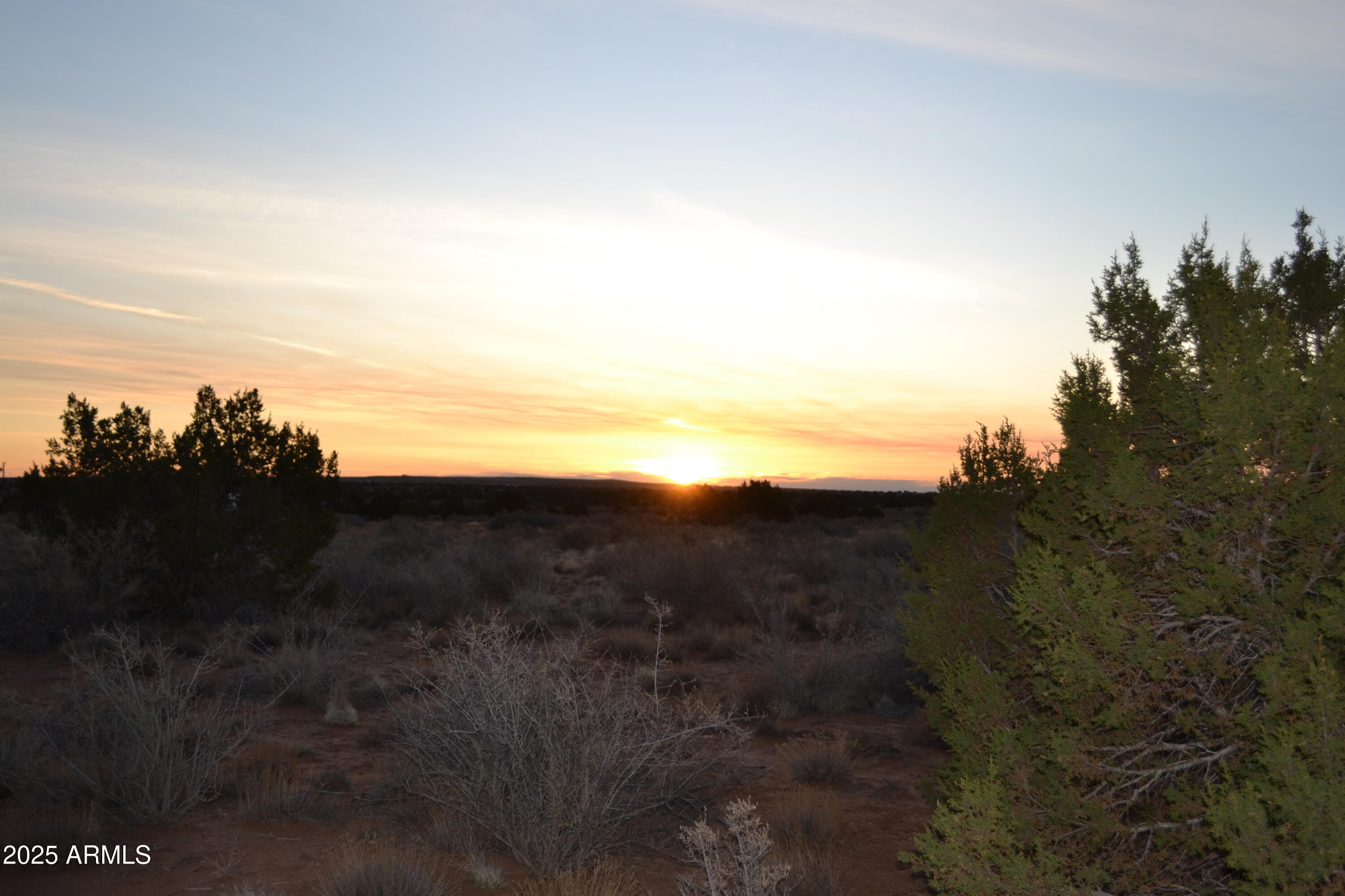 Rare opportunity to purchase 5 acres within the Snowflake City limits. Mostly paved access, approx. .5 mile of dirt road, most of it is maintained. Power is at the lot line, (buyer to verify cost with APS to install). Flat land with some trees and panoramic views. Seller is also selling adjacent acreage, 3 x 5 acre parcels. Snowflake is at an elevation of 5600', enjoy the four seasons, with mild winters, and temperate summers