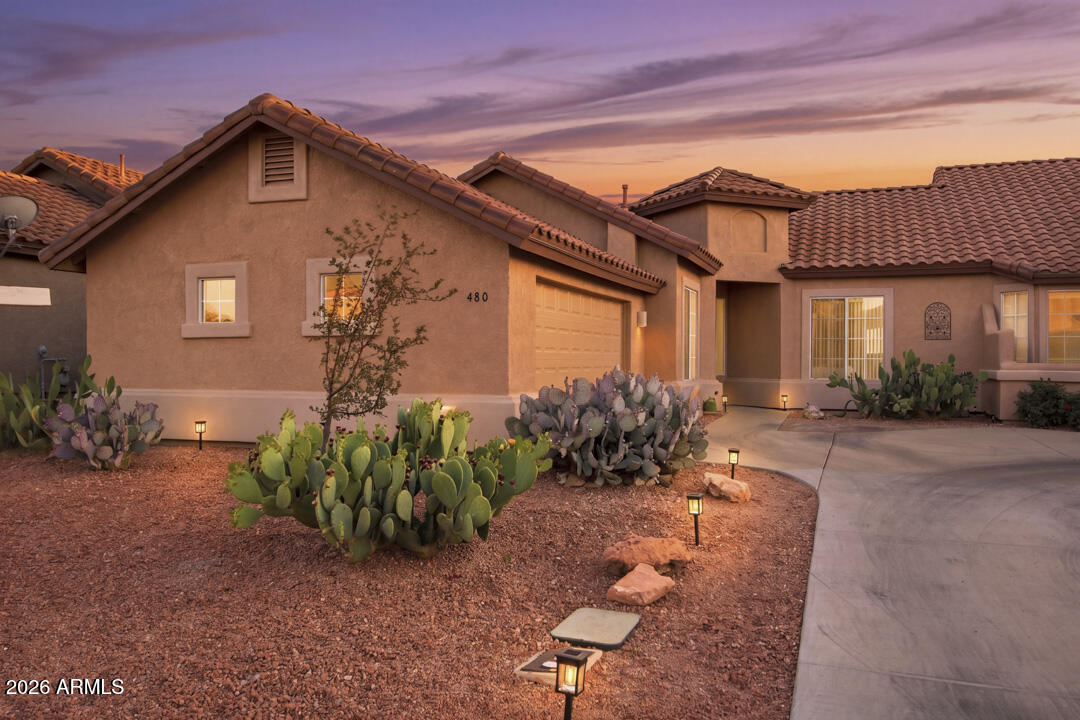 If you desire beautiful panoramic views of Mingus Mountain, a peaceful gated neighborhood, built-in welcoming community vibes with a fabulous Rec Center, salt water pool, spa, gym & golf course...then you have found the one! This well cared for townhome in the gated subdivision of Villas at Verde Santa Fe has upgrades that cover a new roof, fresh exterior paint, new bathroom fixtures, a whole house water filtration system, plus a low maintenance turfed back patio with a drip system. This is a home centered around the Great Room with vaulted ceilings, a welcoming natural gas fireplace & located on a cul de sac, and backs right up to the golf course with the vista of the stunning Mingus Mountain range as your backdrop. As part of your HOA dues, you have a salt water pool just across the gated road for private community use, plus landscaping maintenance of your front yard, and use of the large community clubhouse for your own private events, plus the myriad of hosted community events. There is a hiking trailhead right at the edge of the community, the local Cornville Farmer's Market held weekly is just a few miles down the road, and Sedona is less than twenty minutes' drive. 55+ community, no nightly STR allowed, furnishings negotiable.