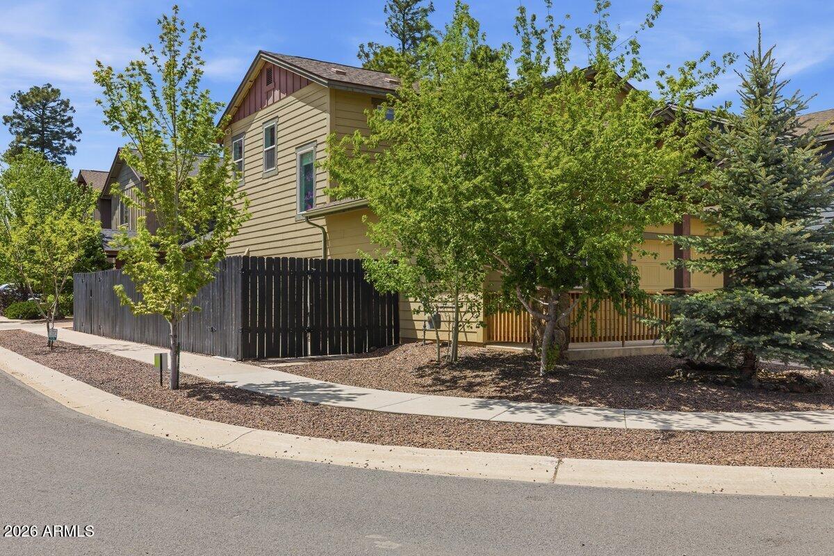 Move-in ready corner lot home in desirable Presidio in the Pines! Built in 2015, this beautifully maintained West Flagstaff residence offers easy mountain living with an open-concept floor plan filled with natural light. Spacious kitchen features an oversized island, rich cabinetry, ample counter space, and seamless flow into the living and dining areas -- perfect for everyday living or entertaining. Upstairs layout provides privacy and functionality while the low-maintenance lot and expanded side concrete area offer flexible outdoor use and added convenience. Enjoy nearby parks, trails, FUTS access, downtown Flagstaff, NAU, Route 66, and endless Northern Arizona recreation opportunities in one of Flagstaff's most sought-after newer communities!