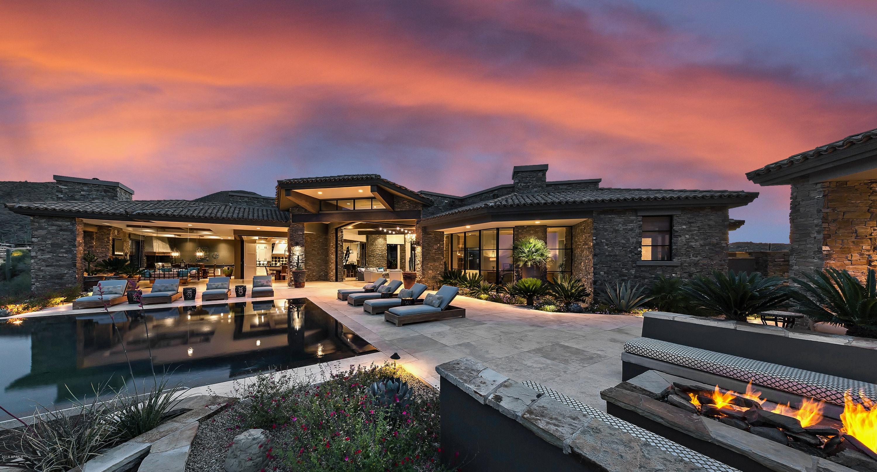 This LEGACY HOME is a stunning ONE LEVEL retreat high on a ridge overlooking Desert Mountain's Chiricahua course and endless, unencumbered city and sunset views of the entire Valley below. The grand, open plan features walls of glass which disappear to provide expansive, seamless indoor-outdoor living, with a protected year-round lanai,complete with outdoor living, dining and culinary center. Secluded master retreat with dramatic spa bath features Carrera marble. Fabulous travertine patio has endless infinity edge pool and spa; private, spacious casita offers view balcony and access to pool. Smart home  includes Control 4 System and all home electronics. Membership to the Desert Mountain Club is available by application. 24 hour notice preferred.