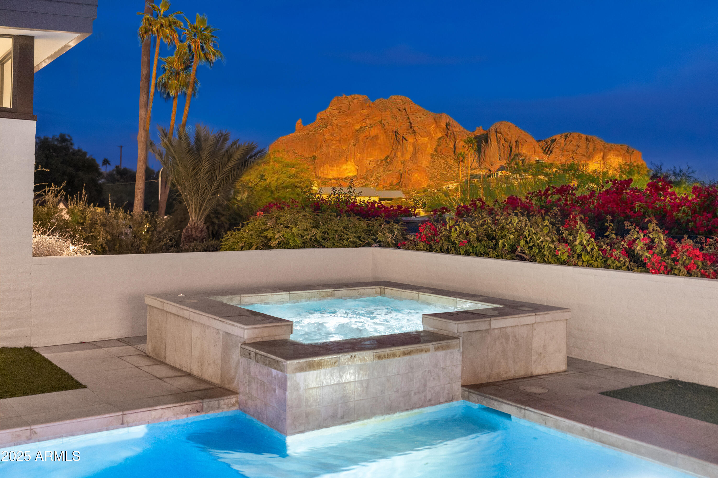 Elegant, Private and Artistic, describes this uniquely sophisticated custom residence on a half-acre hillside lot in Marion Estates w/picture window views of Camelback Mtn & the Praying Monk.  This Executive design offers penthouse style entertaining with 110 linear feet of glass view walls & 5 sliding glass door systems overlooking the pool/spa & mountain beyond. Or, easily shut it down with a few digital panel touches & leave for the weekend.  The home was expanded & fully renovated by GM Hunt in 2020 to 3675sf with 3 Bedrooms + office & 4 ensuite Bathrooms plus an air conditioned oversized 3 car garage/exercise area (not included in the sqft).  Additional amenities include a gorgeous 650sf Master ''showpiece'' Closet, a beautiful Butler Pantry/Laundry, Sub-Zero, Wolf and Meile appliance Ice Maker, whole house water filtration, multiple beverage refrigerators, Stunning Master Bath w/Mountain Views, and an extensive Dog run, all inside a Private, Elevated & Fenced N/S facing lot Secluded from the world beyond.