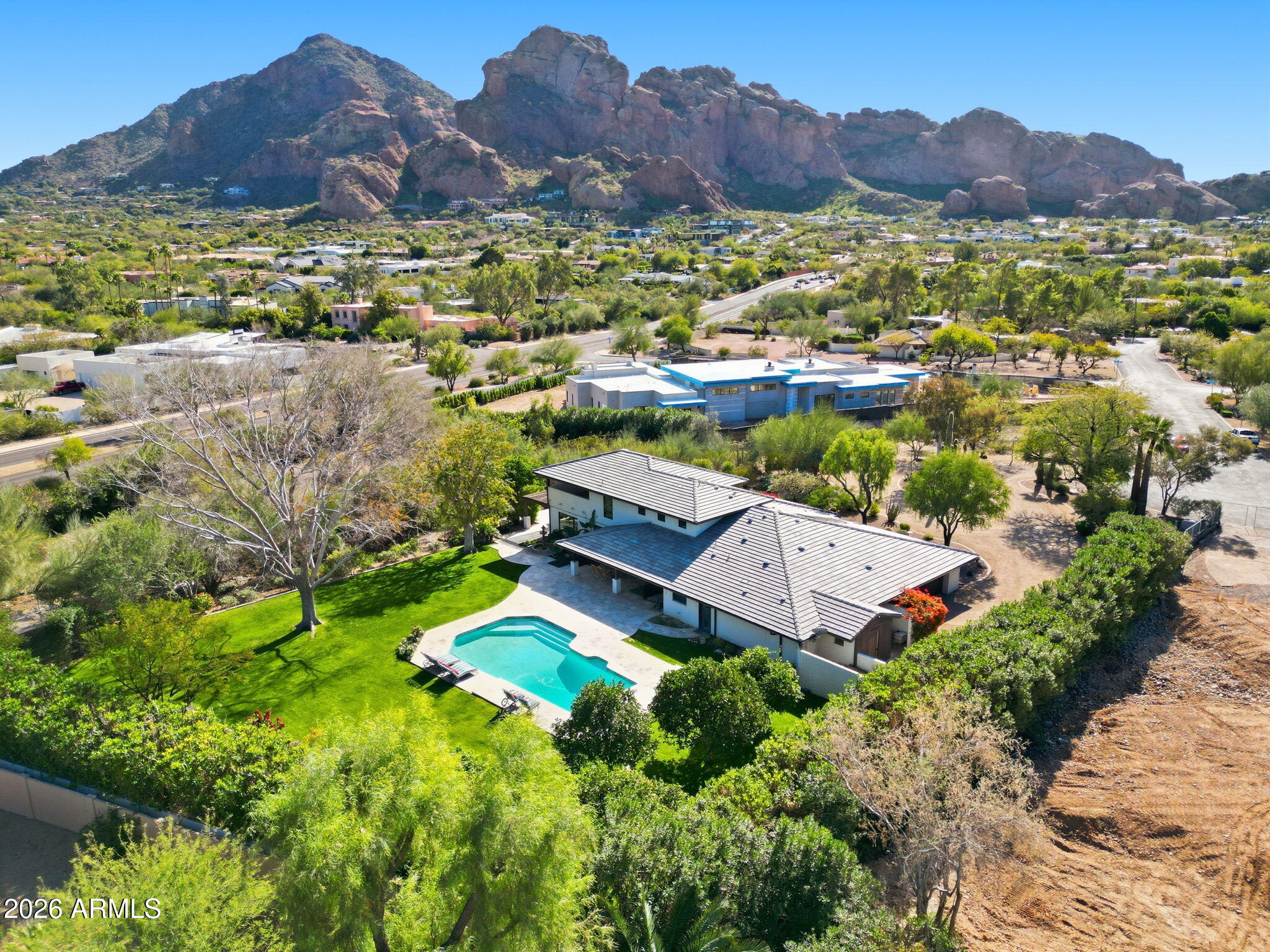 Set within the highly coveted enclave of Paradise Valley, (nestled between 2 multi million dollar new builds) this exceptional 1.4-acre property presents a rare opportunity to create a truly iconic desert estate. Featuring 4,684 square feet, 5 bedrooms, and 4 bathrooms, the residence offers endless potential -- whether enjoyed as a move-in ready home, transformed through a tween 2 multi millionluxury remodel, or reimagined as a spectacular new construction masterpiece. Perfectly positioned to capture breathtaking panoramic scenery, the property showcases incredible 360-degree mountain views, including the dramatic silhouettes of Camelback Mountain, Mummy Mountain, and Piestewa Peak. The expansive lot provides the ideal canvas for elevated indoor-outdoor living, resort-style amenities, and ultimate privacy in one of Arizona's most prestigious locations.
Surrounded by world-class resorts, premier dining, golf, hiking, and all the lifestyle amenities that make Paradise Valley one of the most sought-after luxury markets in the country, this is a truly extraordinary opportunity to live -- or build -- among some of the Valley's most inspiring views.
