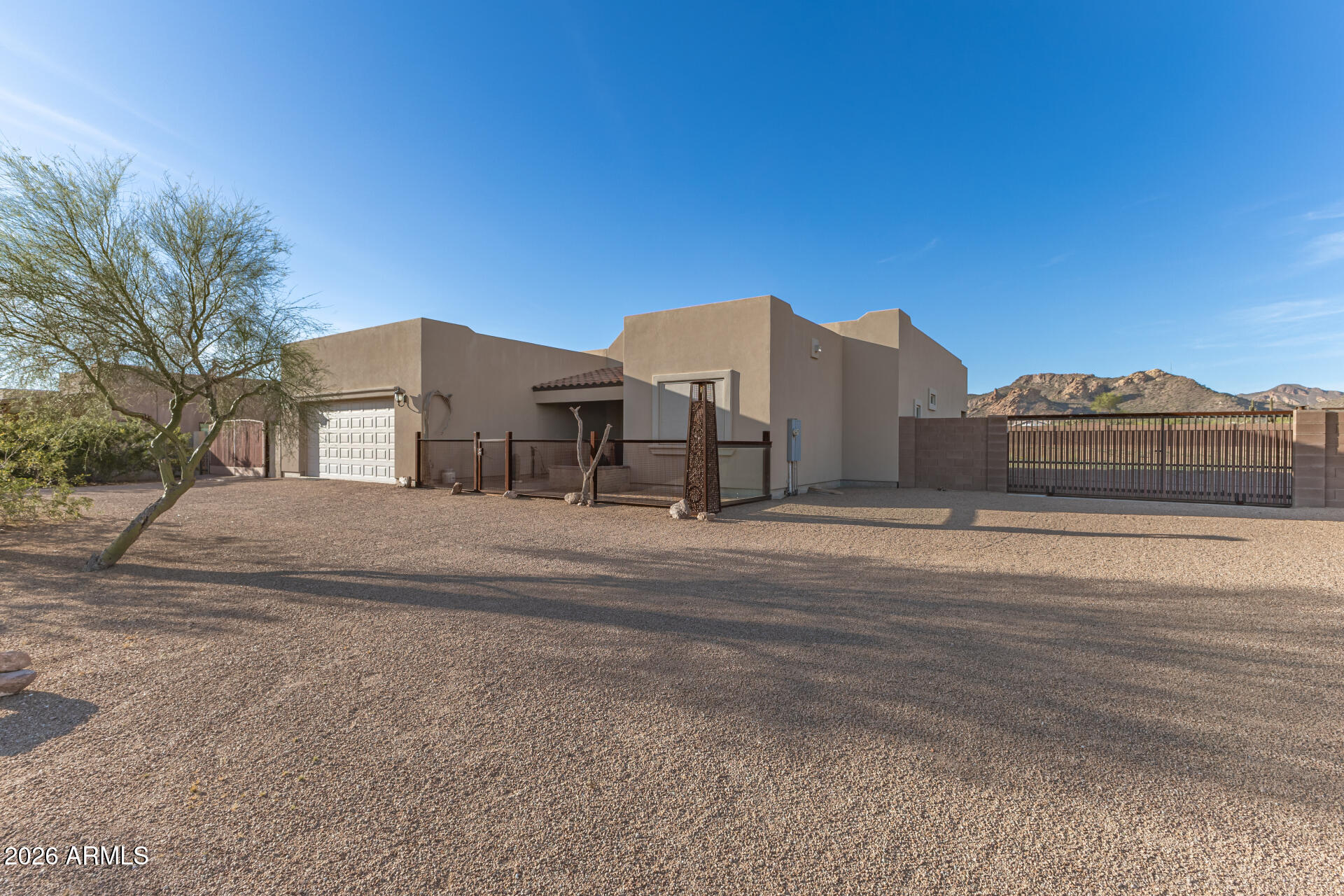 Wake up to breathtaking views of the iconic Superstition Mountains from this inviting 3-bedroom + den home. Thoughtfully designed with flexible living space, the additional den is perfect for a home office, hobby room, or guest retreat.

The home offers a comfortable layout with generous natural light and an easy flow between living spaces--ideal for both everyday living and entertaining. Step outside and take in the dramatic desert landscape and mountain backdrop, where Arizona sunsets paint the sky in unforgettable colors.

Located near hiking, outdoor recreation, and the charm of Apache Junction, this property combines desert beauty, functionality, and scenic living all in one.
Features motorized gate for easy access to your large backyard to store all of your toys or horses!! Kitchen features custom cabinetry and pull out cabinets for easy storage. 
ASSUMABLE MORTGAGE 3.6% $270,000