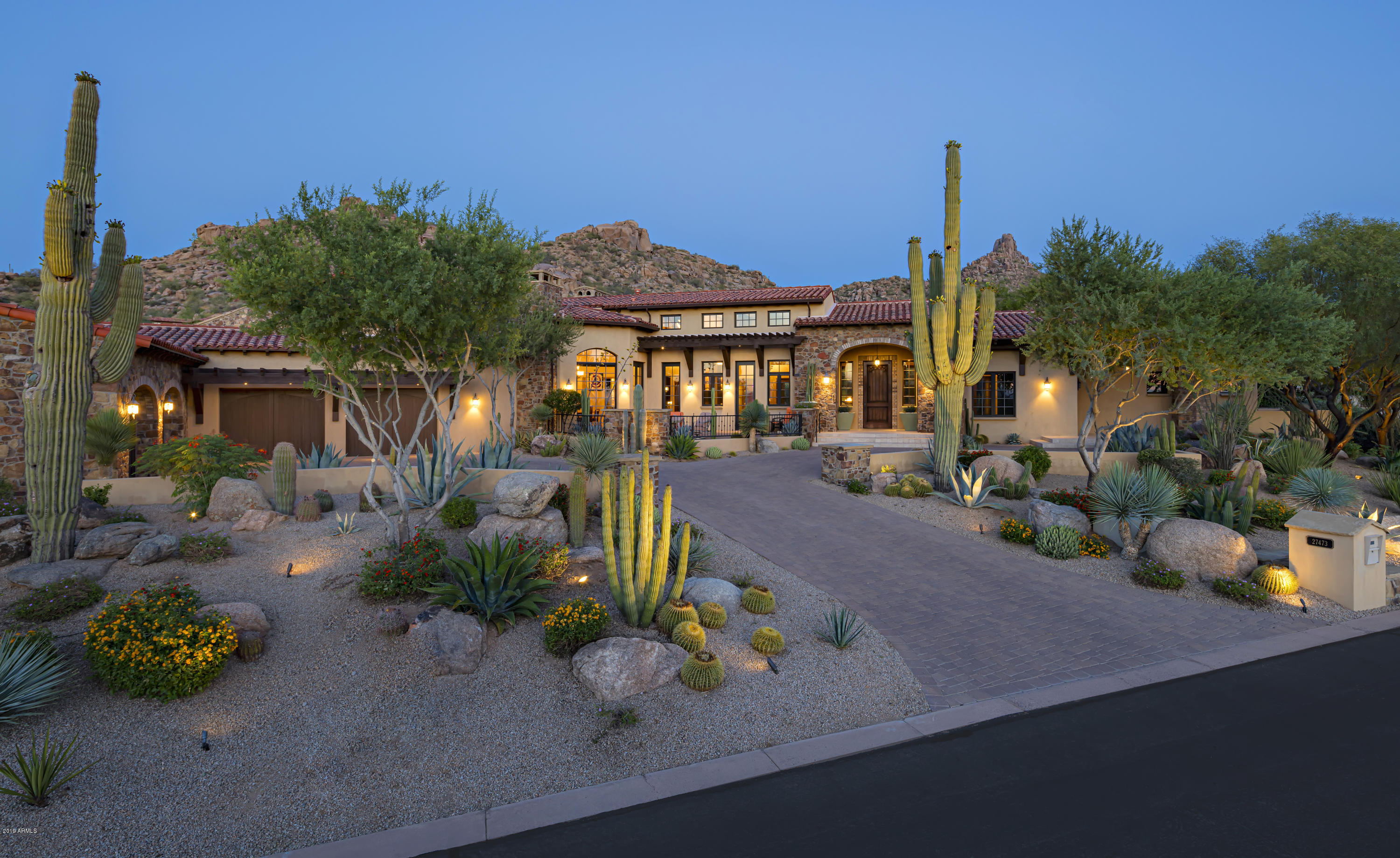 Stunning golf course and Pinnacle Peak views in the guard-gated community of Estancia * Open, great room style home blending traditional elements with contemporary flair * Split floor plan with master wing highlighted by his/her baths, steam shower, sitting room and oversized closet * Custom finishes including solid plank wood and natural stone flooring, venetian plaster, massive beamed ceilings, multiple gas fireplaces and furniture-grade cabinetry * True indoor-outdoor living with a wall of pocketing glass doors giving way to generous covered patios, custom water feature, built-in BBQ center, multiple fire features and heated pool & spa...all with great views of the surrounding terrain * Oversized 4-car garage with storage areas *