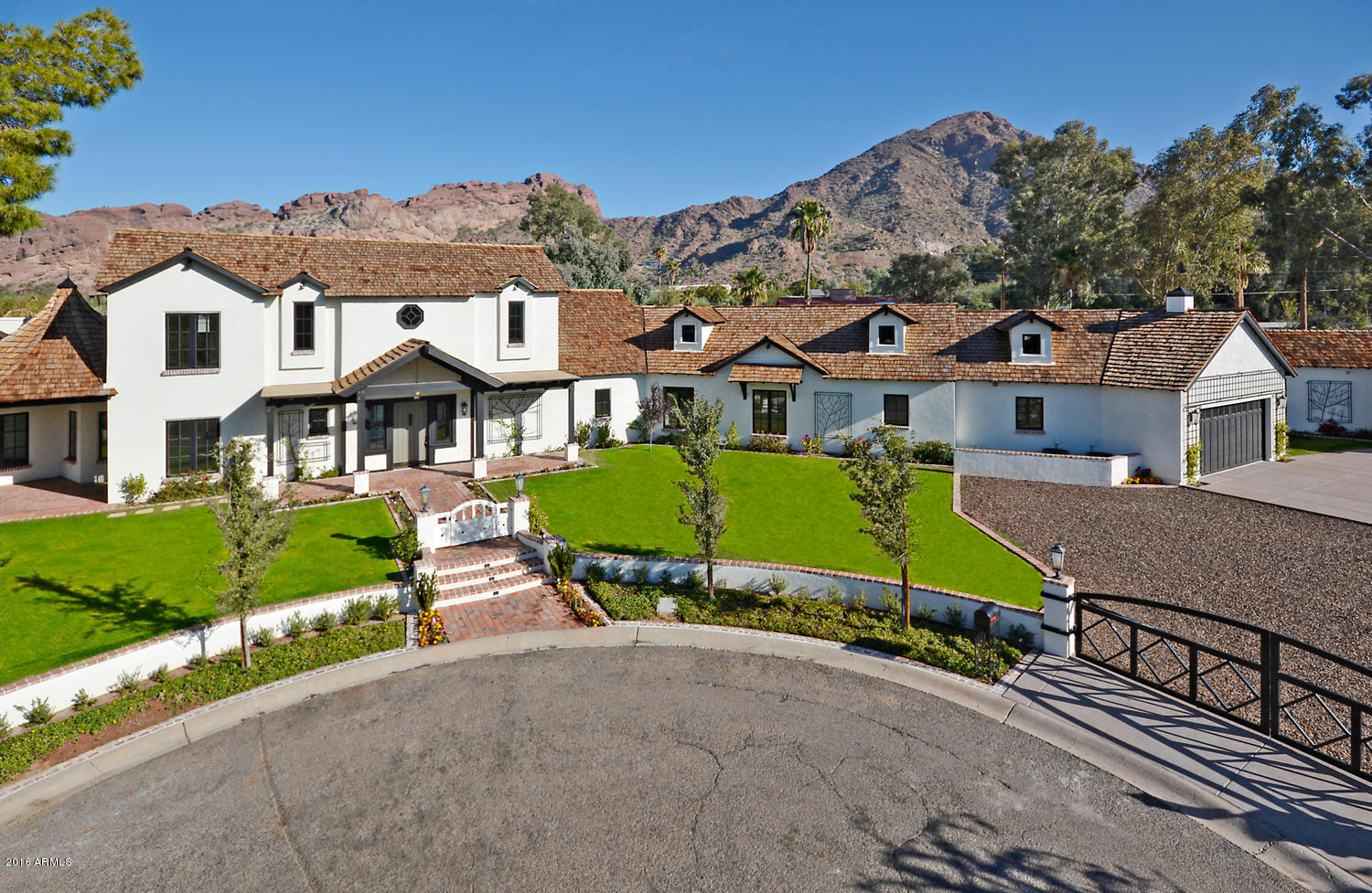 New construction set in the heart of Arcadia w/ picture perfect, panoramic views of Camelback Mountain!  Built by premier builder, Arcadia General, this 7000 sf home will resonate with the most discriminating buyer. Built with the current amenities and fine finish features… this 6 bed/9 bath/office/guest house and a 3 car garage home does not disappoint! Wine enthusiasts will appreciate the climate controlled, walk in wine cellar while those that enjoy the outdoors will love the spacious outdoor kitchen, sparkling pool/spa and massive covered patios. Custom millwork, hand crafted cabinetry and smart home technology…this custom built retreat is move in ready and ready for you! Enjoy the Camelback Mountain views from nearly every room… the great room boasts a disdisappearing wall of glass to welcome you to the lush rear yard and the views beyond.  True craftsmanship in this one of a kind new build... please contact Rebecca or Robin for a private showing!