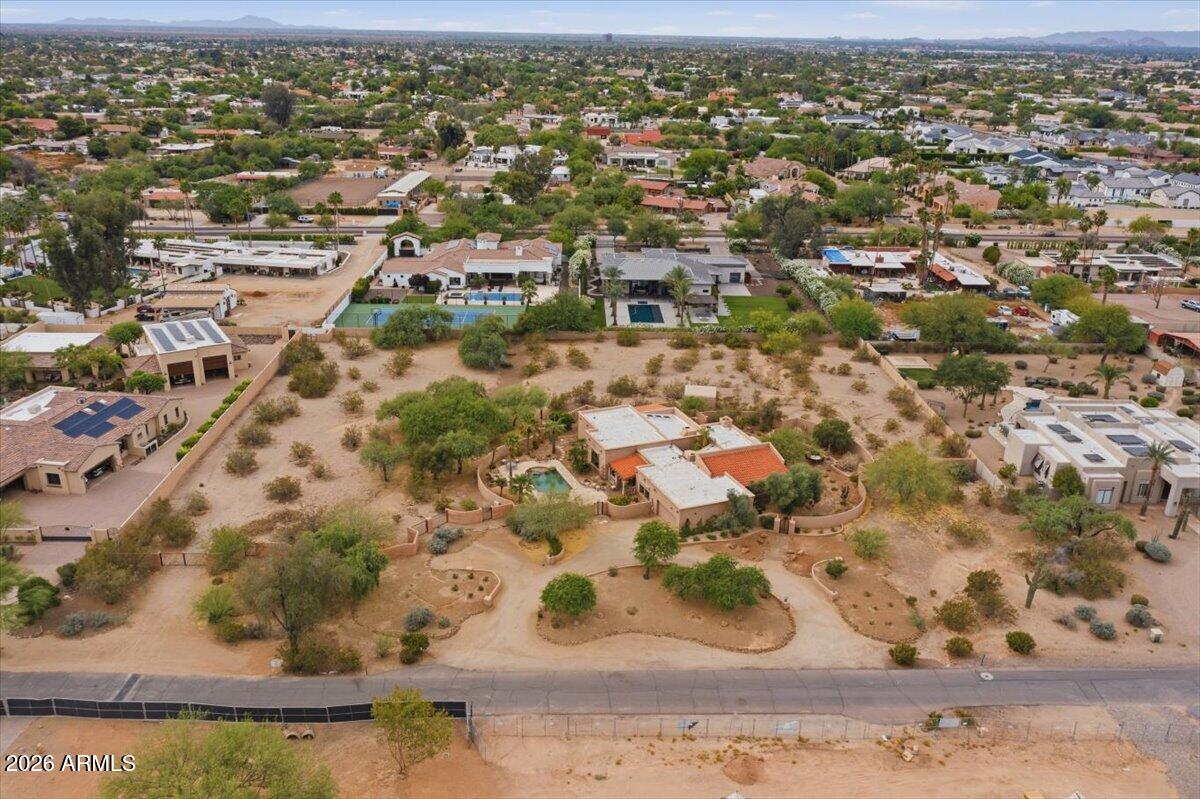 MAJOR PRICE IMPROVEMENT! An extremely rare development opportunity on Scottsdale's most coveted street, Charter Oak. This expansive 2.31-acre parcel offers the unique ability to split the lot, allowing a developer to build two luxury projects simultaneously. Zoning supports the split, with both future homesites having access to all necessary utilities already in place. Surrounded by stunning new construction ranging from $6M-$10M, this property sits in the heart of one of the area's most prestigious enclaves. Whether building spec or custom estates, you have the flexibility to tailor your design, timeline, and margins to maximize profitability in a proven high-end market.