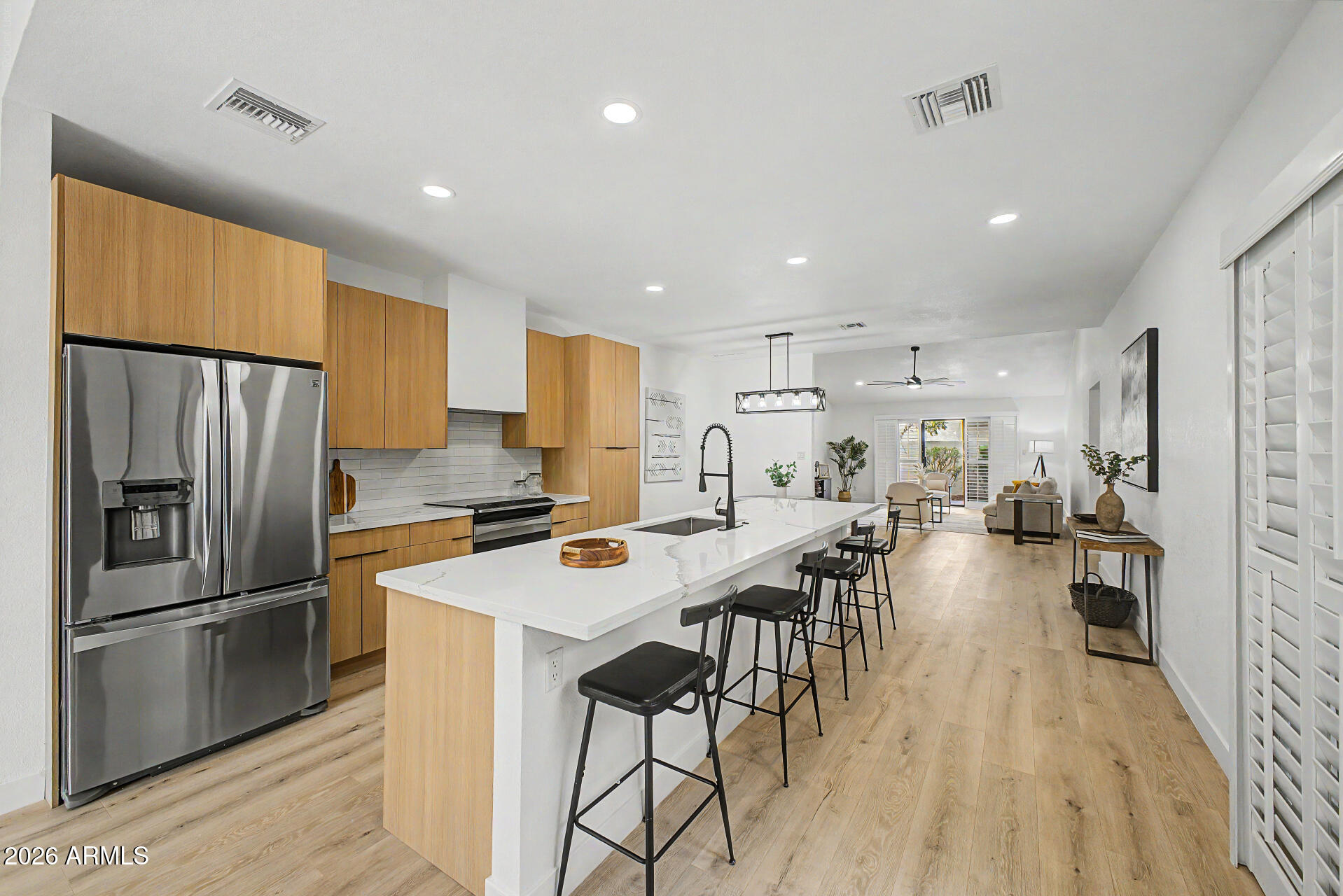 BEAUTIFULLY REMODELED 3-bed, 2-bath townhome in Scottsdale Monterey! A 2-car garage & gated front yard are just the beginning. The interior exudes refined style with fresh neutral palette, vaulted ceilings, plantation shutters, new ceiling fans, new light fixtures, and new wood-look flooring t/out. You'll love the formal living room with a fireplace! The renewed eat-in kitchen boasts SS appliances, new quartz counters, new subway tile backsplash, new flat-panel cabinetry, and new island w/breakfast bar. Each bedroom includes sliding doors to the outdoors, with the primary bedroom having a walk-in closet! Both primary & secondary bathrooms have been updated with newer fixtures for added comfort. Laundry room with overhead cabinetry. If you want to relax, the patios await you! Move-in ready!