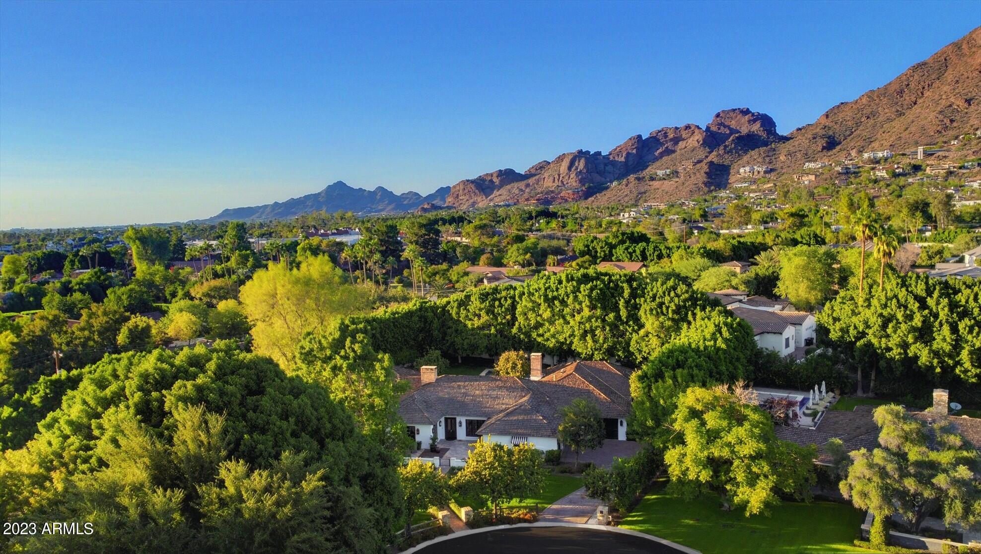 Discover your own private oasis in Arcadia. This stunning luxury estate nestled in the heart of Arizona's most sought-after community is surrounded by lush privacy hedges on a rare oversized  3/4 acre cul-de-sac lot.   Casual elegance with exquisite finishes, this home has been meticulously built with attention to every detail and the finest quality materials by Nance Construction, with wide plank oak floors, spacious Primary Wing with sitting area, desk space, marble bath, expansive closet,  adjoining office and bonus room (nursery, exercise or den).  The 4 secondary bedrooms are split from master, two bedrooms with en-suite baths.  All baths done with the same quality marble detail.  ''Waterworks'' fixtures and hardware through out the home.   The AGA Classic cast-iron range is trul the heart of the home in the thoughtfully crafted kitchen, with large marble Island and walk in pantry.   Home lives larger than its 5,510 sq ft with the  many entertainment areas, but if you need more, full permitted plans are available to add 2 bedroom 1,281 sq ft Casita.    

Professionally landscaped grounds with front and back entertainment area patios to enjoy the green serenity.  This ''European Ranch'' is a timeless piece of art to be enjoyed for generations to come.