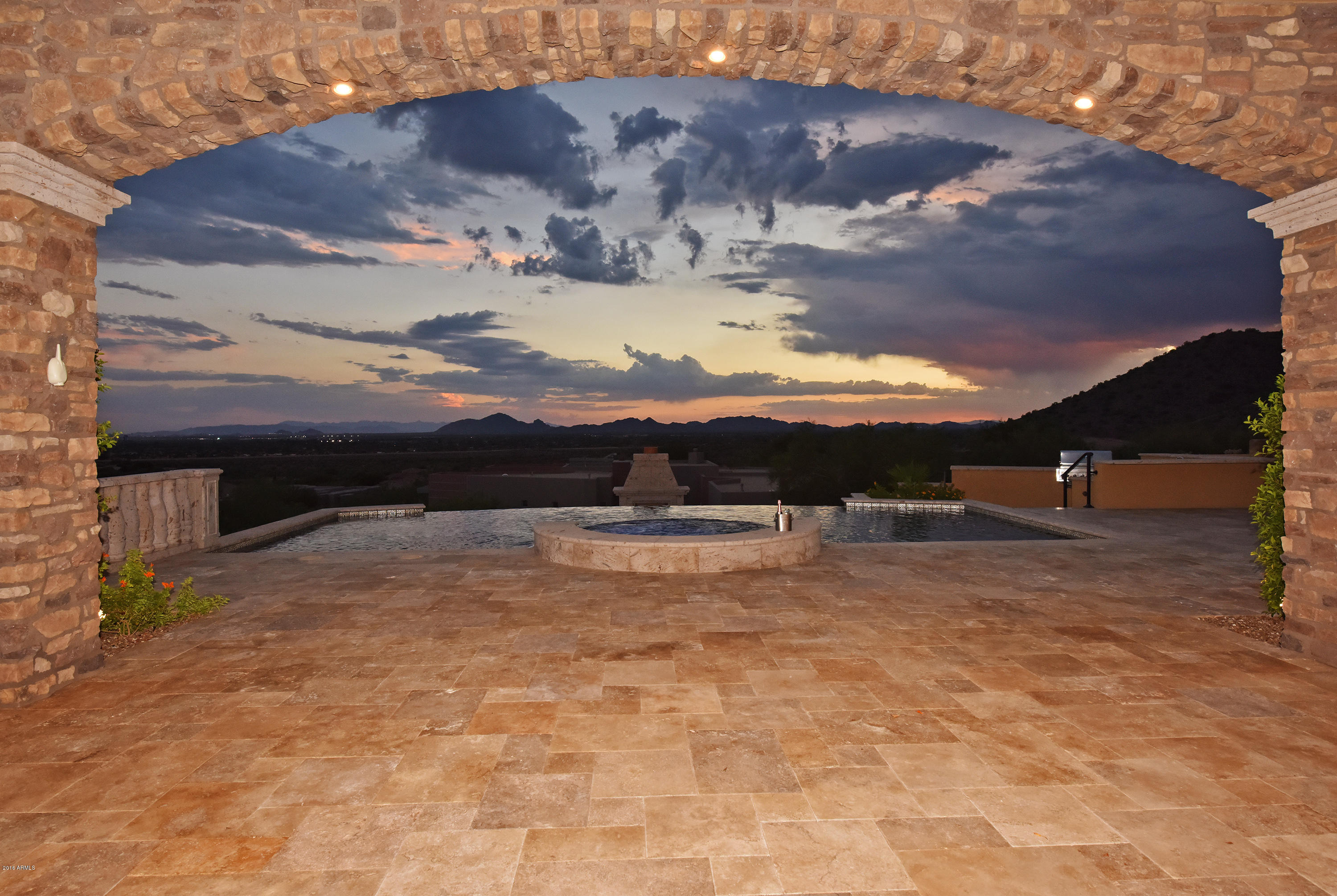 LOOK NO FURTHER…this newest offering by renowned luxury home builders, Patel Development, is completed and move-in ready. The single story, split floor plan, custom estate is tailored for the most discriminating buyers! 

   This timeless home is strategically situated upon one of the best view parcels in Ancala Country Club; designed to capture endless mountain & city light views from numerous vantage points throughout the home. Enter through custom designed iron & glass doors into the fabulous foyer and immediately your eyes are drawn past the floor-to-ceiling disappearing glass sliders to the incredible Camelback Mtn views and resort style backyard; an oasis of desert delight & setting the stage for grand entertaining or intimate gatherings.  READ MORE! A feast of interesting elements & architectural finesse produce a thoughtfully designed home with exceptional attention to detail.  This transitional property accommodates flexible living with endless options.

The gourmet kitchen anchors the dramatic great room, which is designed to create intimate spaces within.  Together they flow effortlessly into the designer backyard that is ready for entertaining.

The owner's suite is a true sanctuary boasting of incredible views, a mesmerizing sitting area with a wet bar & cantera fire place, as well as a bonus room (to be used to fit your lifestyle desires).  You'll find that the owner's suite bath is one of the best designed master baths around with top of the line luxurious finishes throughout that will WOW you & your buyers!  

The guesthouse enjoys a full kitchen, living room, private patio, and separate garage along with a generous en-suite bedroom - all with easy access to the main house.

A private motor court and  expansive  four-car garage completes the package and provides plenty of room for vehicles and storage.

Look no further, this rare single story home will provide inspired living and breathtaking sunsets, creating ambiance and a casual yet elegant lifestyle for the fortunate buyer that acquires this home. 

SEE DOC TAB FOR FEATURE/SPEC PAGES!  Peruse the slide show and MLS pictures for a taste of the incredible floor plan, spaces, and finishes in this gorgeous estate.  BUT YOU MUST SEE IN PERSON TO CAPTURE THE OVERALL BEAUTY OF THIS HOME!