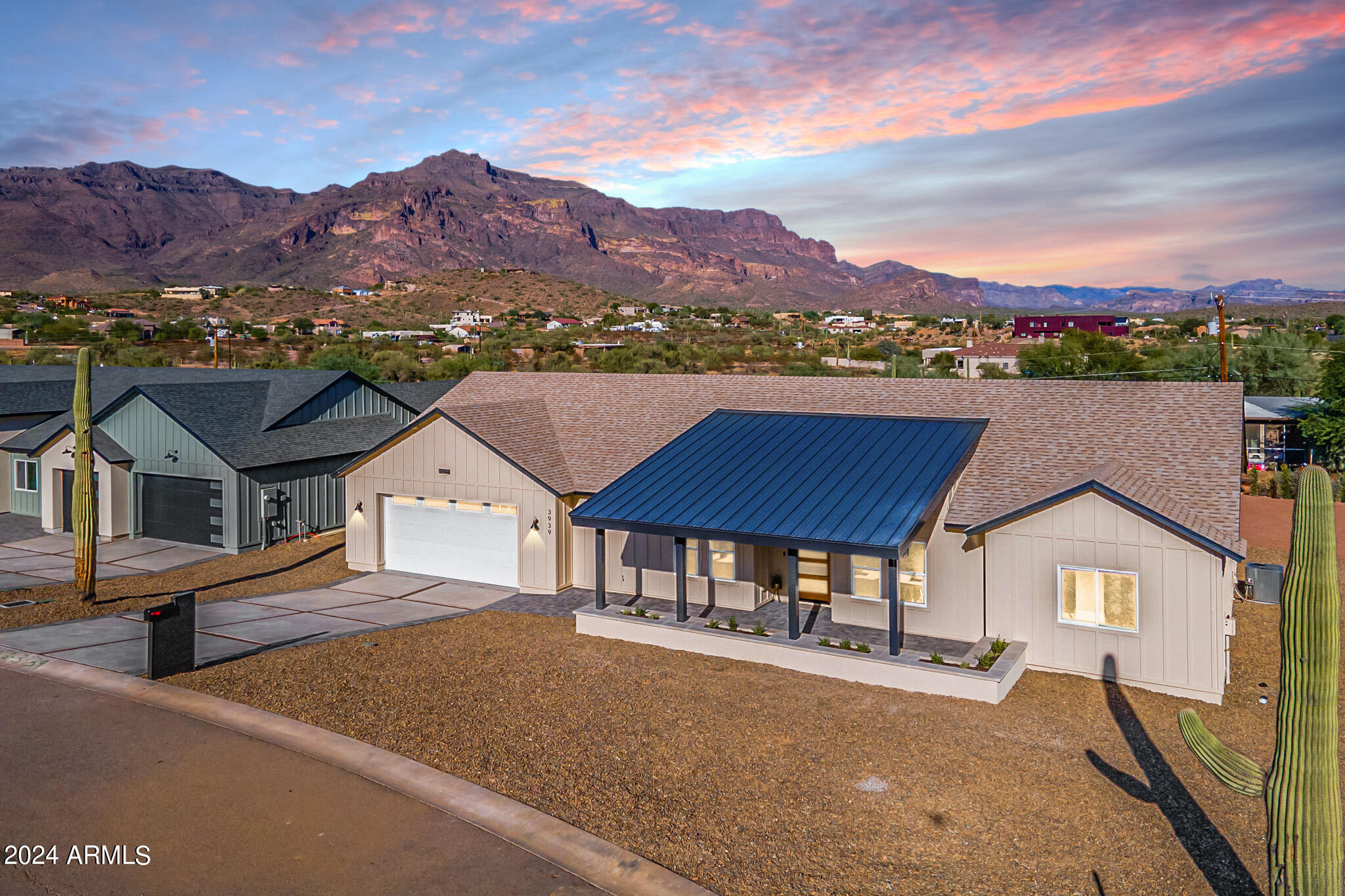 Welcome to Montana Dorada, the best kept secret in Gold Canyon Arizona. This single level home is part of an exclusive Modern Farm Desert Collection. Offering paved roads and iconic views of the Superstition Mountains. Over 5000 sf under roof and 2989 livable. Large patios in both the front and back. Complete with 4 bedrooms, 3 bathrooms, large island, beverage bar, and a butler's pantry. Sitting on almost a 16,000-sf lot complimented by an amazing view of the 9th hole at Dinasaur Mountain Golf Course. This split floorplan offers a large owners' suite and private entrance to an oversized covered patio. Guests can enjoy a beautiful ensuite with a private entry complete with a beautiful view of the golf course pond and 9th hole putting green. Designed with earthy organic neutral accents. Enjoy the beautiful pond and golf course views from the large glass sliding backdoor, owner's suite, guest suite, and even the kitchen island. The neutral earthy design throughout featuring wood, gold, copper, and black accents were inspired by the Arizona Desert and were carefully chosen to suit any style. The large yard is a perfect place to design a backyard oasis with some of the most sensational views in Arizona. The boutique community of Montana Dorada is situated perfectly in Gold Canyon. With hilly paved roads and quick access to the 60 freeway. Enjoy unparalleled views of the majestic Arizona mountains, sensational sunrise, and sunsets, combined with timeless modern living.