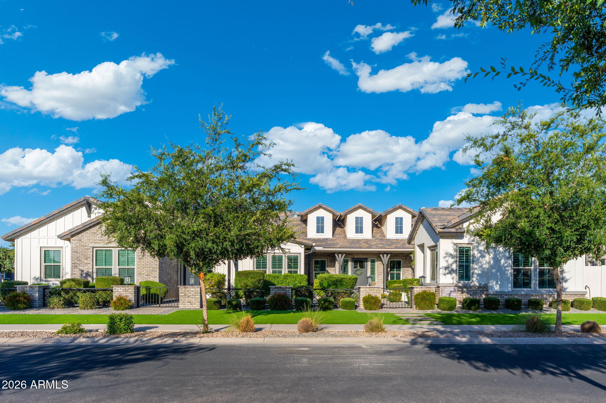 This stunning home features lush landscaping, creamy white interiors, and elegant stone finishes throughout. Located in the prestigious Whitewing Whisper Ranch community, this exceptional property offers 5 bedrooms, 5.5 bathrooms, attached casita, resort-style pool, and a 4-car garage across just under 5,000 square feet -- perfectly designed for entertaining or enjoying a peaceful retreat.

From the moment you enter, you're welcomed by an open-concept floor plan filled with warm yet modern designer upgrades and thoughtful details throughout. Expansive walls of glass seamlessly connect the indoor living spaces to the spectacular backyard oasis. The outdoor living area is truly an entertainer's dream, featuring raised garden beds, a sparkling pool, a covered BBQ and sports bar area perfect for hosting friends and family, and a custom firepit where you can relax under the stars on cool desert evenings.

The spacious primary suite offers a luxurious escape, complete with a spa-inspired bathroom showcasing floor-to-ceiling designer tile, an oversized walk-in shower, and a generous walk-in closet.

The main residence includes 4 bedrooms and 4.5 bathrooms, while the detached casita provides a comfortable private living space with its own living room -- ideal for guests or multigenerational living.

This one-of-a-kind home combines luxury, comfort, and timeless style in one unforgettable setting. Don't miss the opportunity to make it yours.