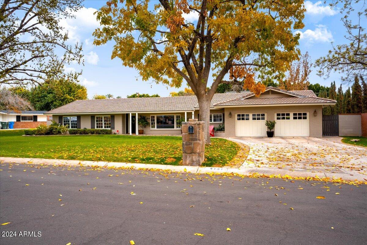 Situated in the prestigious Hilker Estates neighborhood, at the heart of Arcadia Proper, this alluring home boasts the quintessential charm of an Arcadian Ranch. It features four bedrooms and four bathrooms, including a split primary bedroom offering stunning views of the pool and Camelback Mountain. Additionally, there is a fifth room which serves as a very large bonus room complete with an en suite bathroom and a walk-in closet, offering the flexibility to be used as a fifth bedroom if desired. The recently remodeled pool enhances the home's appeal. The kitchen has been updated with sleek quartz countertops and high-end Monogram stainless steel appliances, adding to the luxury and convenience of the home. It also includes a spacious three-car garage with a tandem spot opening into the backyard, providing convenient access. Positioned on an expansive lot over 20,000 sqft, the property offers plenty of room for potential expansions. The house has been meticulously updated, including a recent re-underlayment of the roof, ensuring its excellent condition and readiness for immediate move-in. This property represents an incredible opportunity to enjoy the best of Arcadia living, combining nearby conveniences with the serenity of a distinguished neighborhood. Adding to its allure, the location is a short walk from Hopi Elementary School. It's also conveniently close to the esteemed Arizona Country Club and just a short ride from the vibrant shopping and dining scenes in Old Town Scottsdale, including the Scottsdale Waterfront, Fifth Avenue Shops, and the upscale Scottsdale Fashion Square.