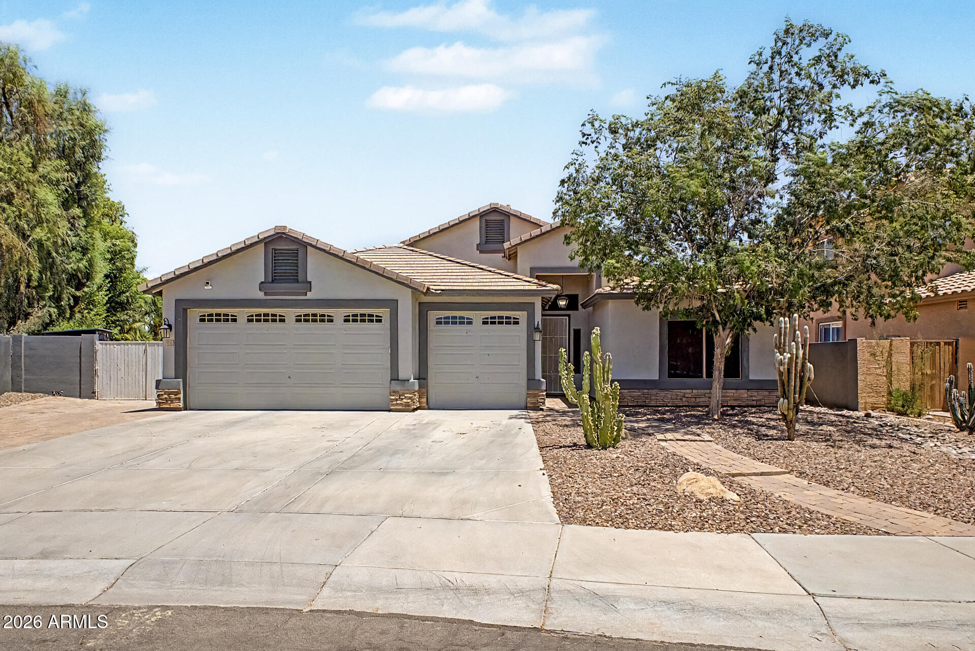 Beautiful home in the coveted neighborhood or Rockwood Estates. This spacious home w/ hard to find 5 bdrms on lrg lot w/ pool. Plus this home has a finished basement (always cool) great room flr plan w/stunning kitchen featuring 42'' white cabinets, stainless steel appliances, gas or electric cooking, granite cntrtops, brkfast bar & pantry. This home has high coffered ceilings & beautiful wood/tile flooring. The primary suite has a lrg walk-in closet, separate vanities & custom snail shower. Additional upgrades include central vacuum, surround sound, water softener, RO system. Extended 3 car garage with insulated doors. Full length covered patio overlooking bckyrd with pebble tec pool & wtrfall feature.This is truly a unique home which merges style & comfort. Perfect for the AZ lifestyle.