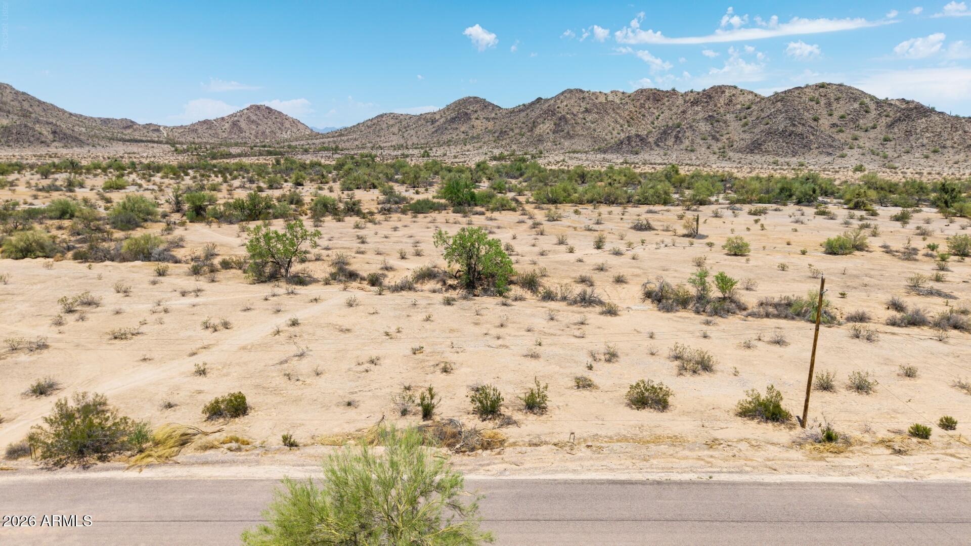 Exceptional opportunity to own 3.3 acres of Arizona landscape! This expansive parcel offers incredible flexibility and panoramic mountain views. Enjoy rural tranquility while staying just a short drive from central Maricopa amenities, shopping, dining, and major commuting routes.