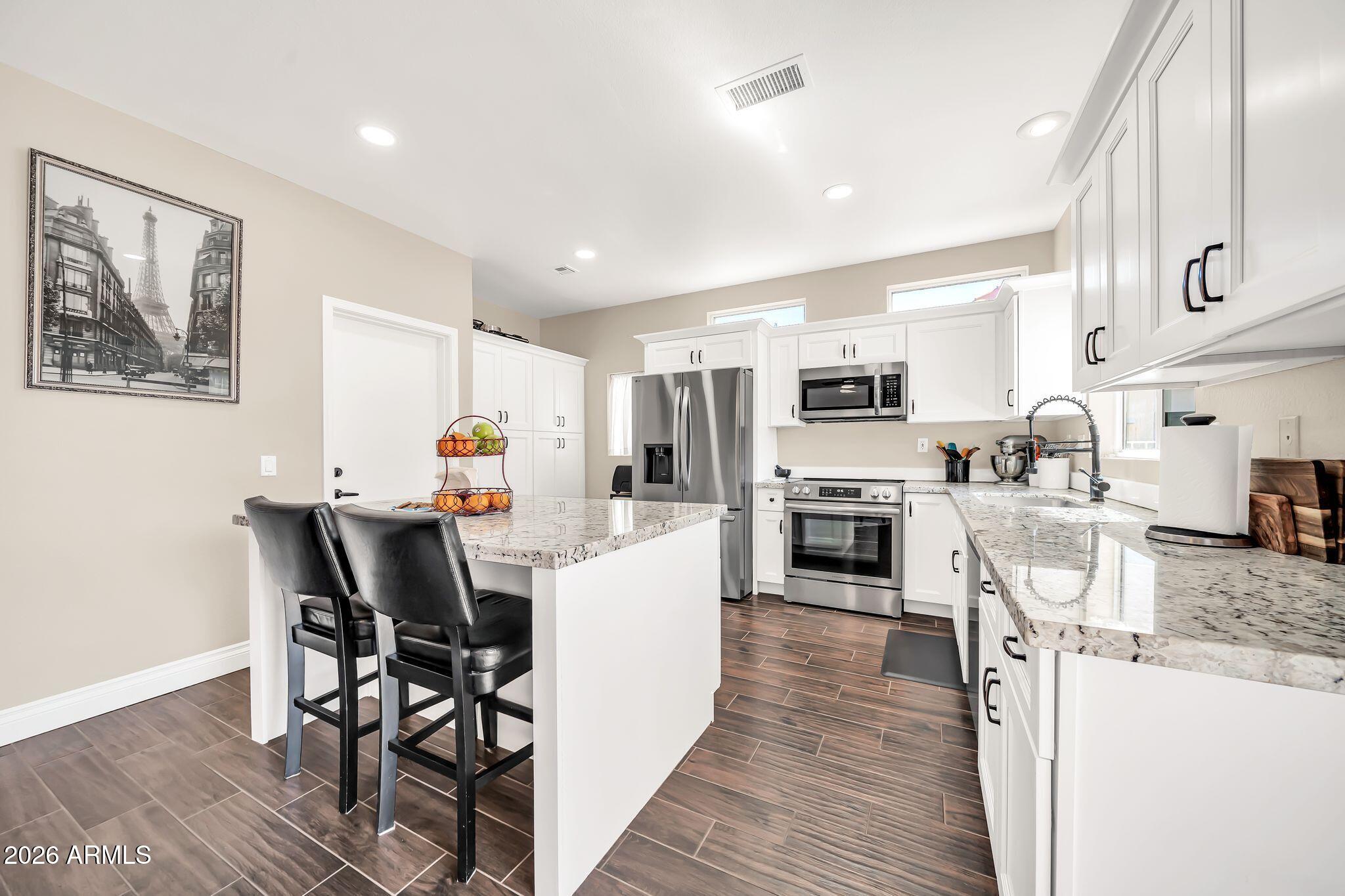 BEAUTIFULLY REMODELED AND MOVE-IN READY! UPDATED ISLAND KITCHEN with CUSTOM WHITE CABINETS, GRANITE COUNTERTOPS, and STAINLESS STEEL APPLIANCES. OPEN GREAT ROOM LAYOUT connects the living, dining, and kitchen areas for a bright, spacious feel.

HUGE 14' x 37' BONUS ROOM offers endless flexibility for entertaining, hobbies, or additional living space. EXTENDED GUEST BEDROOM with DOUBLE CLOSETS. TILE PLANK WOOD-LOOK FLOORING throughout.

Additional upgrades include ROOF REPLACED IN 2022, FENCED BACKYARD, and many more improvements throughout the home. Clean, updated, and ready for its next owner.