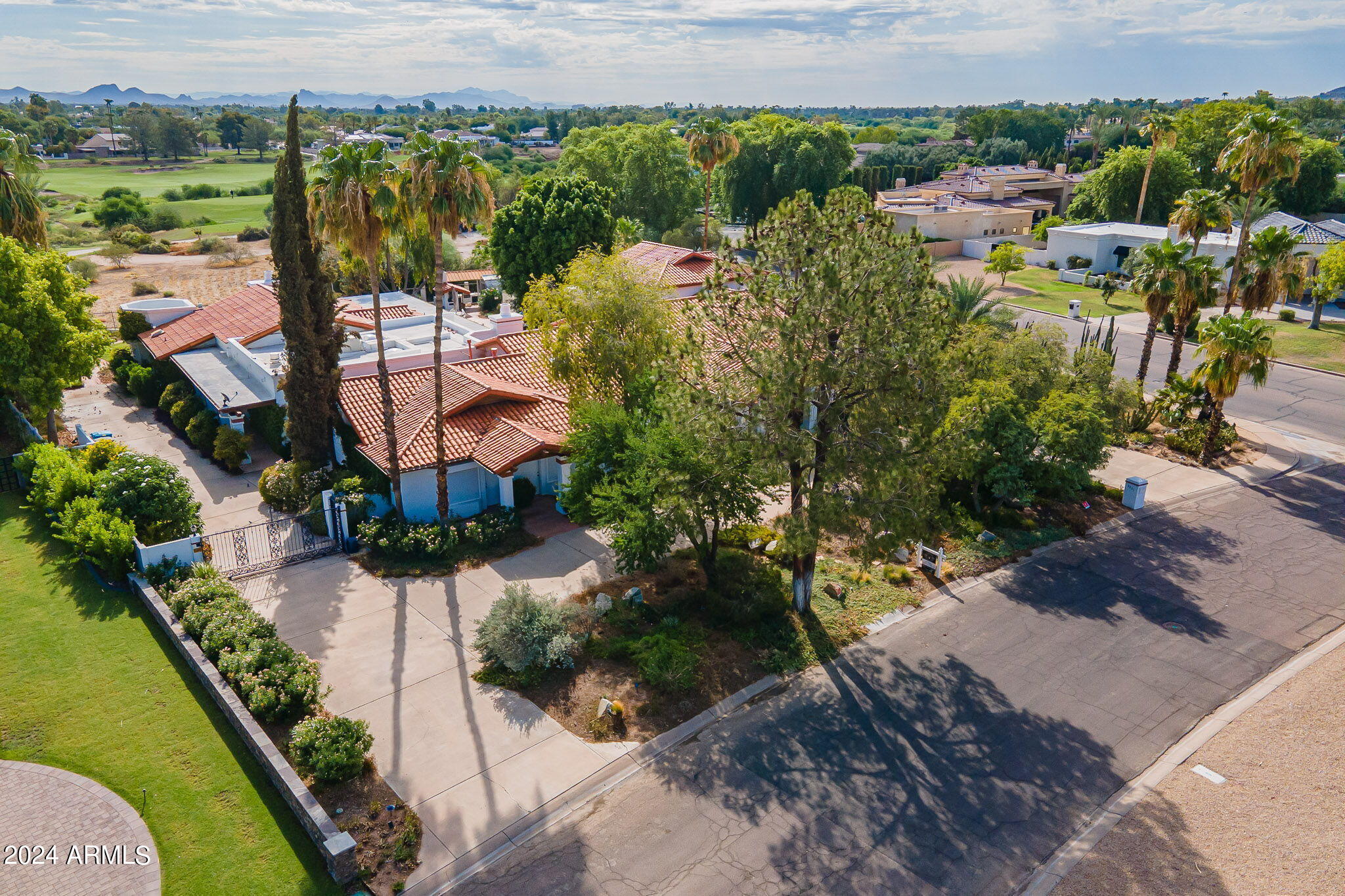 This Paradise Valley Estate has never been on the market and is being sold in As Is condition. 
This one of a kind home was custom built in 1991 and exhibits many unique qualities including multiple attached guest quarter suites and an indoor swimming pool. Main house is 2 bedrooms + an office. Additional bedrooms are located in multiple attached guest quarters   Situated on nearly .8 acres adjacent to Camelback golf course and impeccably maintained, this is a rare opportunity in Paradise Valley.