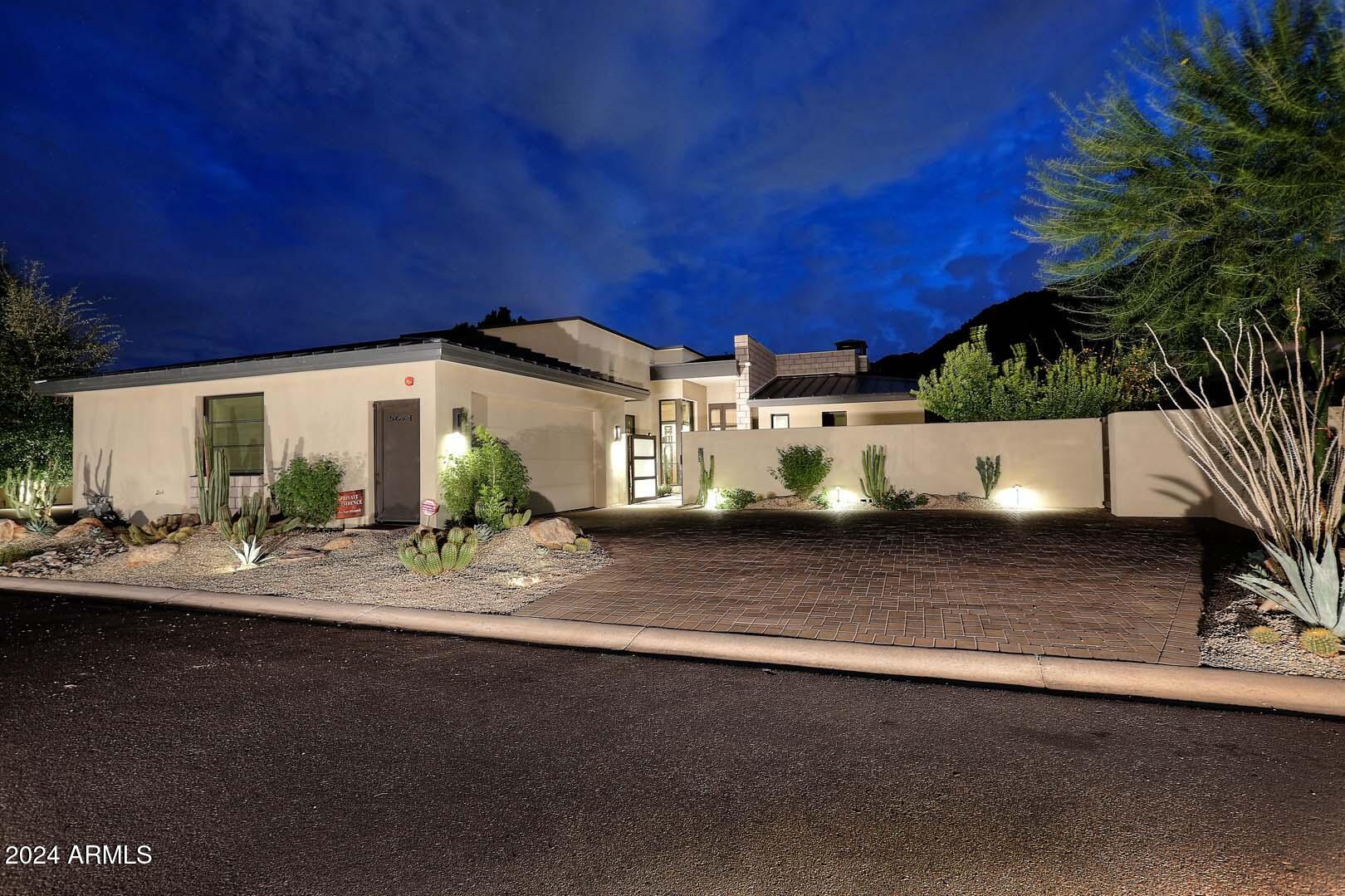 This exceptional one-level, ideal lock and leave home was custom designed by Mark Candelaria, Architect and the Interiors were designed by David Michael Miller. The Owners chose this premier homesite within the guard gated Village at Mountain Shadows because of its outstanding views of Camelback Mountain and the Praying Monk. This residence offers 3 BR's, 4 BA's (all ensuite) plus a Powder Room, Formal Dining, Breakfast Room and a Breakfast Bar in addition to a great Exercise Room and/or Office or potential 4th BR if a closet was installed. Features include a dry sauna, Waterworks fixtures and Wolf, Sub-Zero and Bosch appliances.