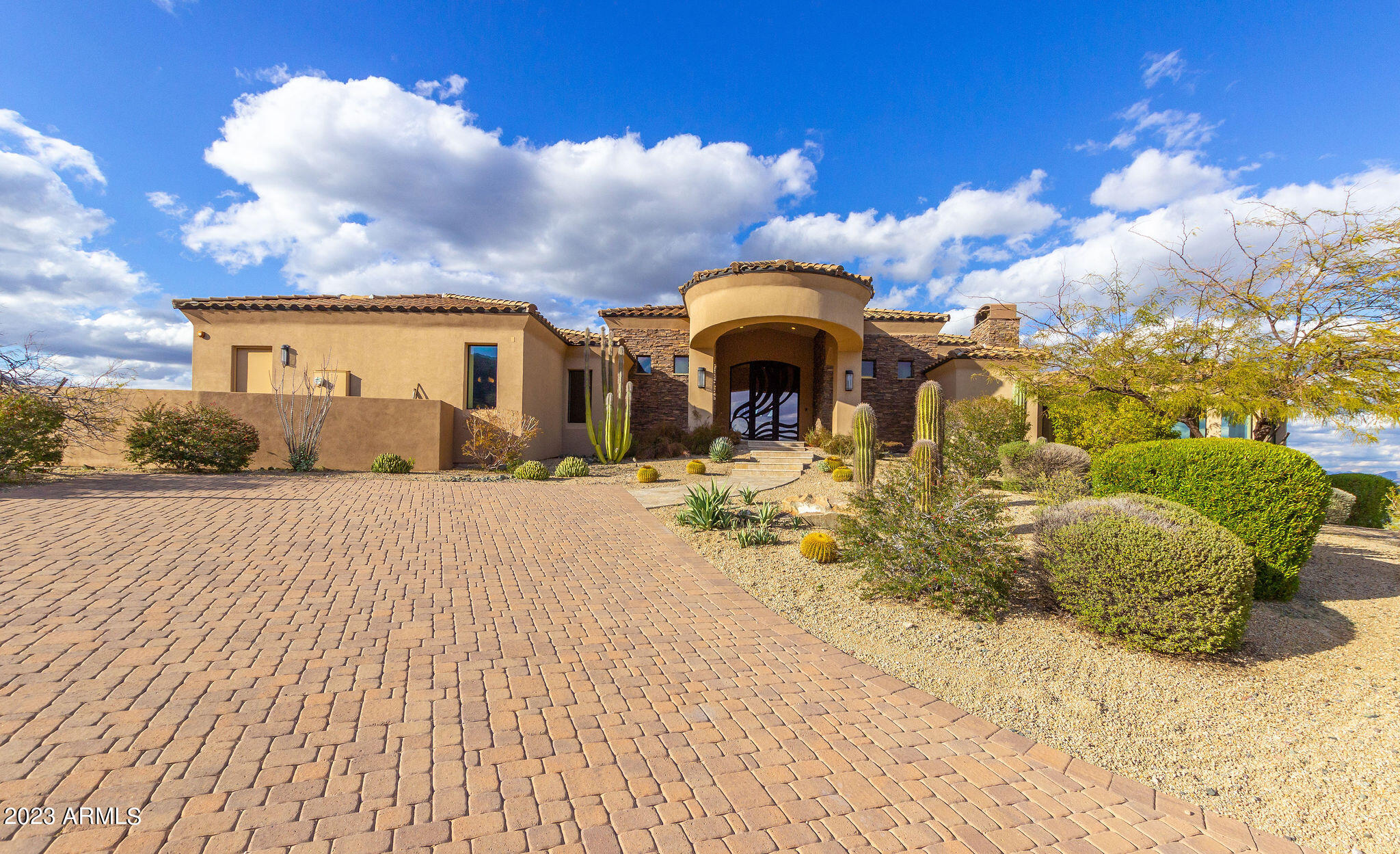 **SELLER FINANCING AVAILABLE AT 2.99% AND 30% DOWN** Live in the lap of Luxury in Eagles Nest! This luxurious 5 bedroom, 7 bathroom house is nestled on a 1.8 acre hilltop lot w/optional extra acre available, offering unparalleled views of the surrounding mountains & cityscape. As you enter the gated community & make your way up the hill, you'll be greeted by breathtaking views from every angle. Step inside & take in the grandeur of this exceptional home. The spacious living area boasts soaring ceilings, floor-to-ceiling windows, and stunning custom finishes throughout. Entertain in style in the formal dining room, or gather with family & friends in the open concept gourmet kitchen, complete w/SubZero & Wolf appliances, ample counter space & center island for meal prep and casual dining... After a long day, retreat to the luxurious master suite, which offers a cozy fireplace, a spa-like en suite bathroom, with views that will take your breath away. Additional 2nd master suite with direct private patio access. Four additional spacious bedrooms provide plenty of room for family and guests, each with ample bathrooms for maximum comfort and private Theater Room. Lower level flows to outside lower pool area and experience the true definition of resort-style living. The tiered backyard offers multiple levels of outdoor living space, a sparkling 2-tiered pool w/swim-up bar, perfect for hosting summer barbecues. And of course, you'll never tire of the sweeping views from the wrap-around balcony, which offers a perfect spot for enjoying a cup of coffee in the morning or a glass of wine at sunset. To ensure that your stunning views are always protected, an additional 1-acre lot is available for purchase. And with the peace of mind of living in a guard-gated community, you'll feel secure and content in your new home. This exceptional property truly has it all  breathtaking views, luxurious finishes, and an idyllic outdoor space that will leave you feeling like you're on vacation every day. Want more privacy and protect your views? Additional 1 acre lot directly in front of property also available for sale to combine to make a 2.8 acre compound. Lot can be sold as a package or separately. Don't miss your chance to make this dream home a reality. Schedule a viewing today!
