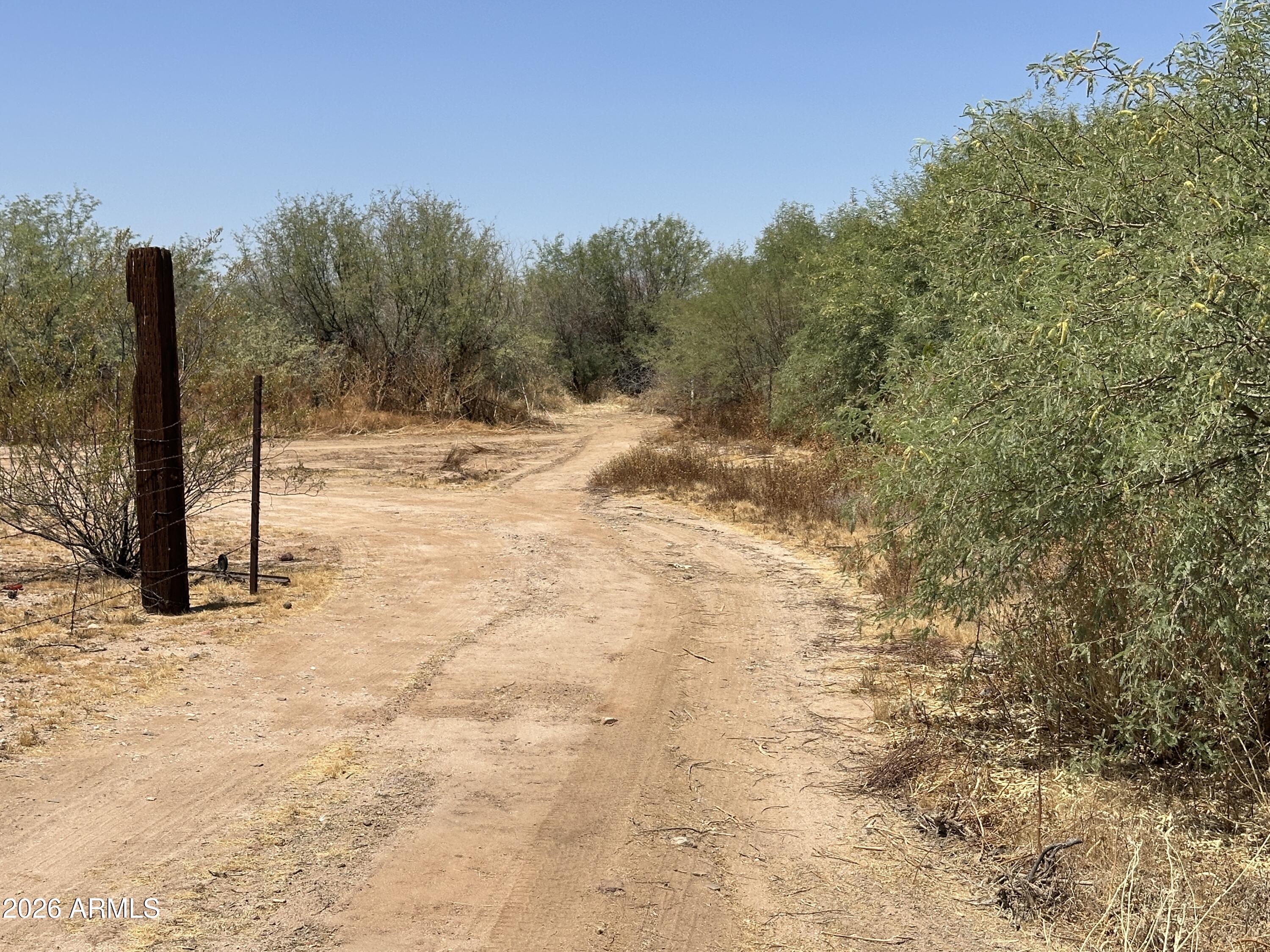 Discover the freedom of wide-open Arizona living with this beautiful vacant horse property. Offering expansive views, breathtaking sunsets, and plenty of room to build your custom home, barn and corrals, this property is ideal for horse enthusiasts and anyone seeking a peaceful rural lifestyle while still being conveniently located near local amenities