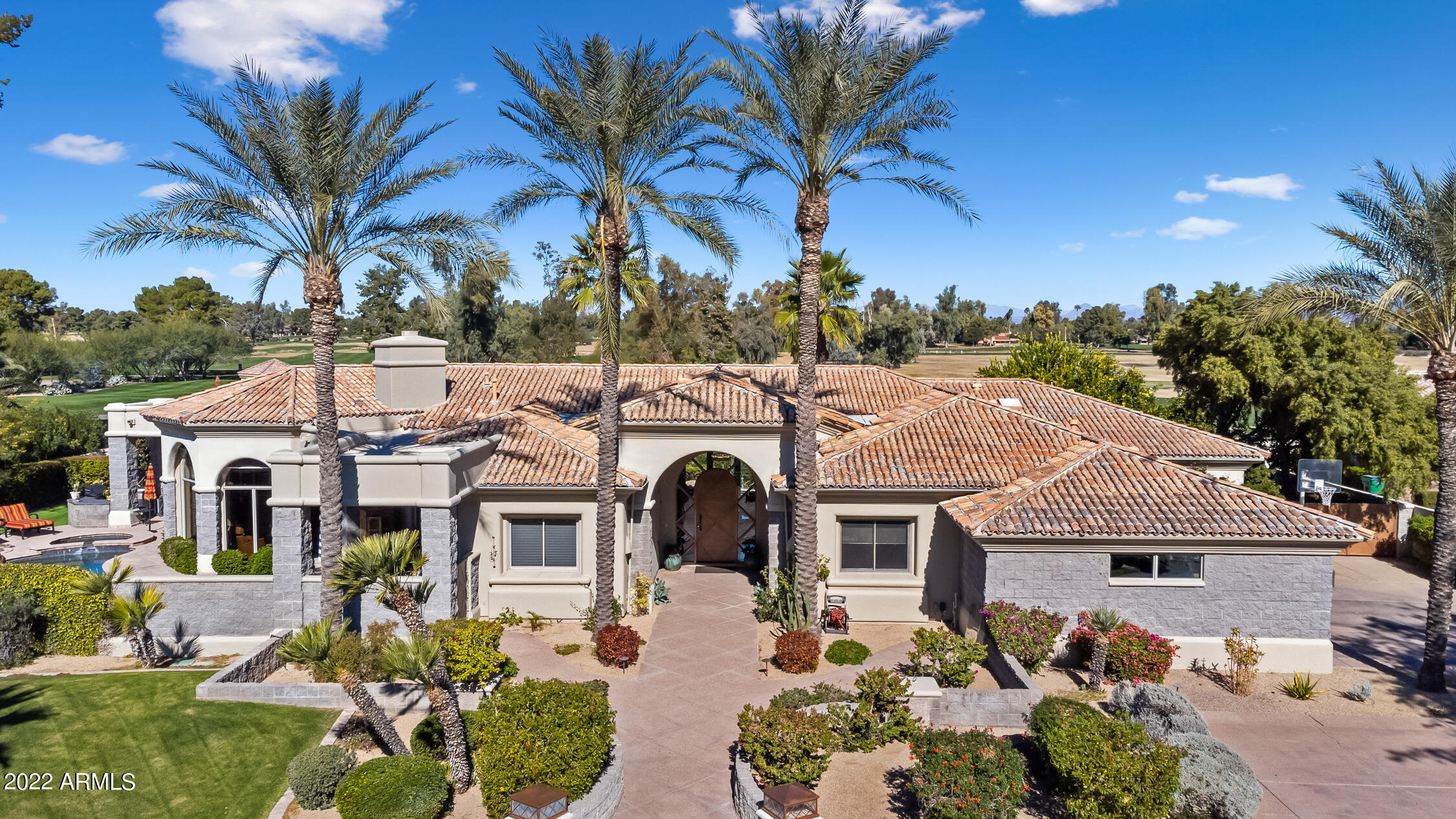 The absolutely best home for the price in the heart of Paradise Valley; and an absolute rare opportunity to own in Exclusive Ironwood Estates...exclusive gated 9 custom home subdivision. Located in the exclusive Ironwood at Camelback Country Club community this 5 bedroom Golf Course property that is North-South facing. Most would agree this is the community to be in where you can step right outside to the member's only driving range and putting green. Backyard is a perfect retreat for entertaining your guests or just relaxing by the tranquil & peaceful Pebbletec pool & spa with rock water feature that includes 2 waterfalls & built-in slide! Mountain views and acres of lush greens are the backdrop which adds to the charm of this magnificent home. Situated in an excellent location!