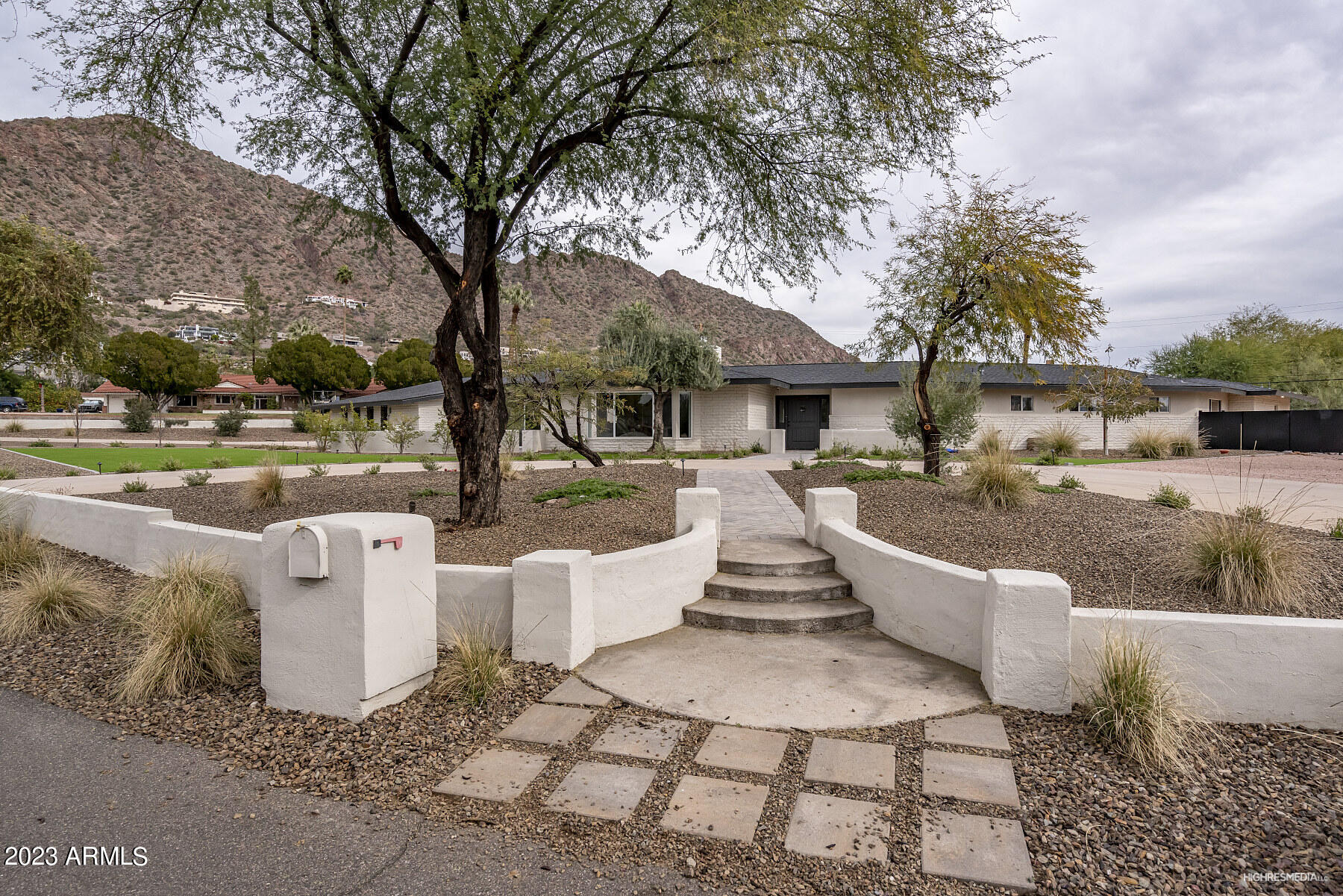 This sprawling single story newly remodeled family estate sits on a flat 42,149 square foot view lot on Royal View Drive, one of the most desirable streets in Arcadia/Camelback Mountain. It offers over 5,000 square feet of living space, a open floorplan, 5 bedrooms, two offices, 5 bathrooms, a 2 car garage and a second detached two car garage that has been converted into a guest quarters without permits. The property has an amazing backyard with a pool and stunning Camelback Mountain views.