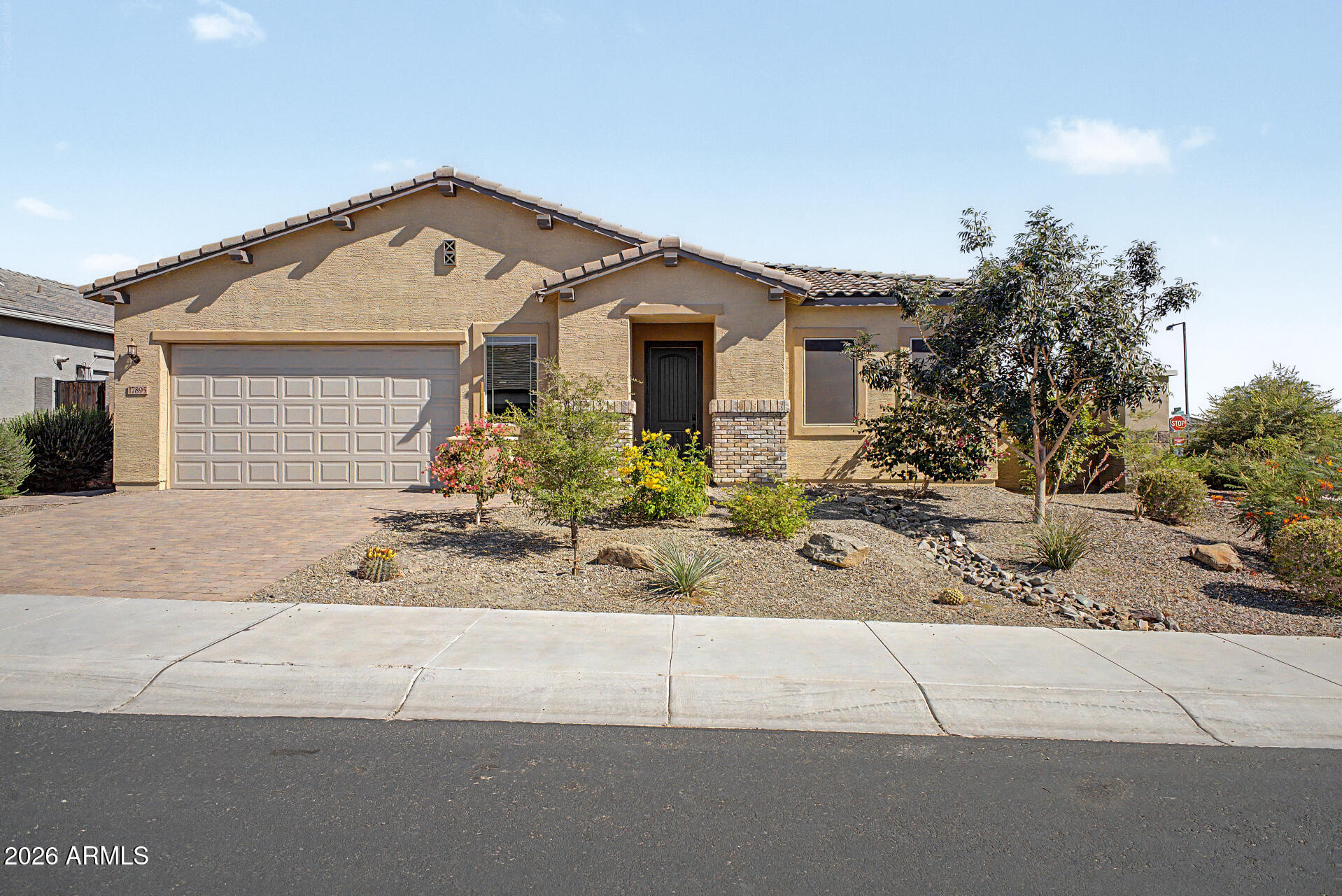 Take advantage of this incredible opportunity to own a beautifully maintained home featuring OWNED SOLAR and thoughtful upgrades throughout.
Situated on a desirable corner lot in Goodyear's highly sought-after CantaMia community, this home welcomes you with an open-concept layout, soaring ceilings, and stunning accordion doors that create seamless indoor-outdoor living.
The kitchen serves as the heart of the home, complete with granite countertops, stainless steel appliances, a pantry, and a large island with breakfast bar seating. The spacious primary suite offers a private retreat with dual vanities, a walk-in shower, and a generous walk-in closet with direct access to the laundry room for added convenience. A versatile den provides the flexibility to create a home office, study, fitness room, or hobby space.
Step outside to a thoughtfully designed backyard featuring a covered patio, extended paver area, dog run, and mister system, creating the perfect place to enjoy Arizona's beautiful weather year-round.
Living in CantaMia means enjoying resort-style amenities including indoor and outdoor pools, a fitness center, pickleball and tennis courts, scenic walking trails, lakes, parks, and a vibrant social calendar designed for an active lifestyle.