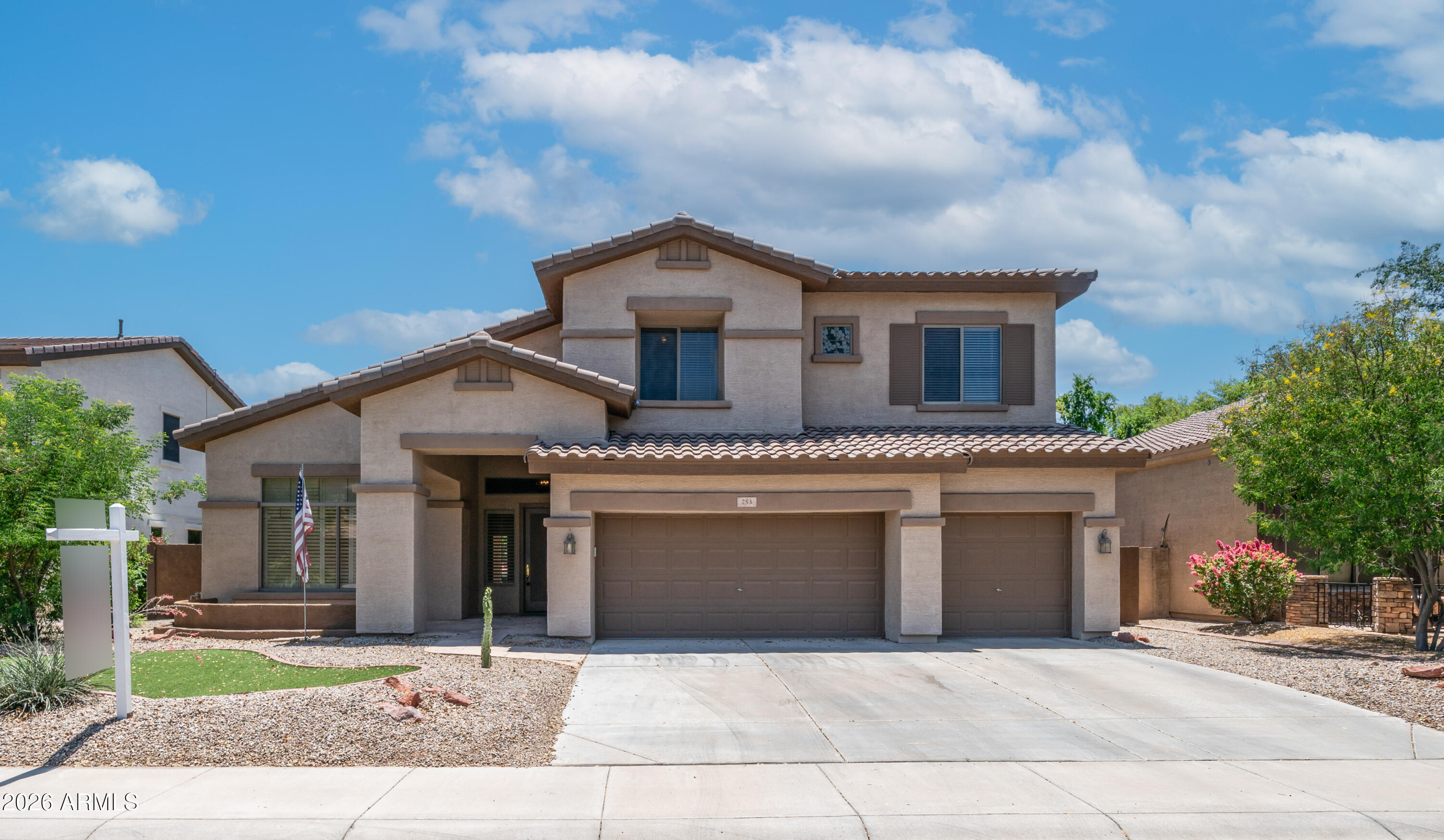 Located in a gated south Chandler community sitting next to Bear Creek Golf course, close to shopping, dining and entertainment.  Featuring an inviting family room with stacked stone gas fireplace; kitchen has island looking into the spacious family room.  Formal living & dining areas for entertaining guests. Newer Roof & AC unit!  Desirable master bedroom downstairs w/ double door entry, a large walk-in shower, dual vanities & walk in closet.  Private laundry room has lots of storage & ironing board. Guests can use the powder room on the main floor.  Upstairs large game room or additional family room!  Nice size secondary bedrooms & bathroom. Amazing backyard featuring pool w/rock waterfall grotto, a hot tub to relax & enjoy after a game of golf or on a cool winter evening. Extended pergola to enjoy the indoor/outdoor lifestyle! Green artificial turf for kids or pets to play.  Enjoy looking out to the view fencing that gives the large backyard an even larger feel with green grass and mature trees and shrubs!  This is a desirable community with great schools. It's located next to the 6.5-mile Paseo Trail featuring a 10-foot-wide concrete multi-use pathway on the eastern side of the Consolidated Canal. The western side of the canal is an unimproved dirt surface that can be used for horseback riding or bicycling. It has become very popular with walkers, joggers, stroller-pushers, bicyclists, and even horseback riders on the west side of the canal that the City of Chandler maintains.