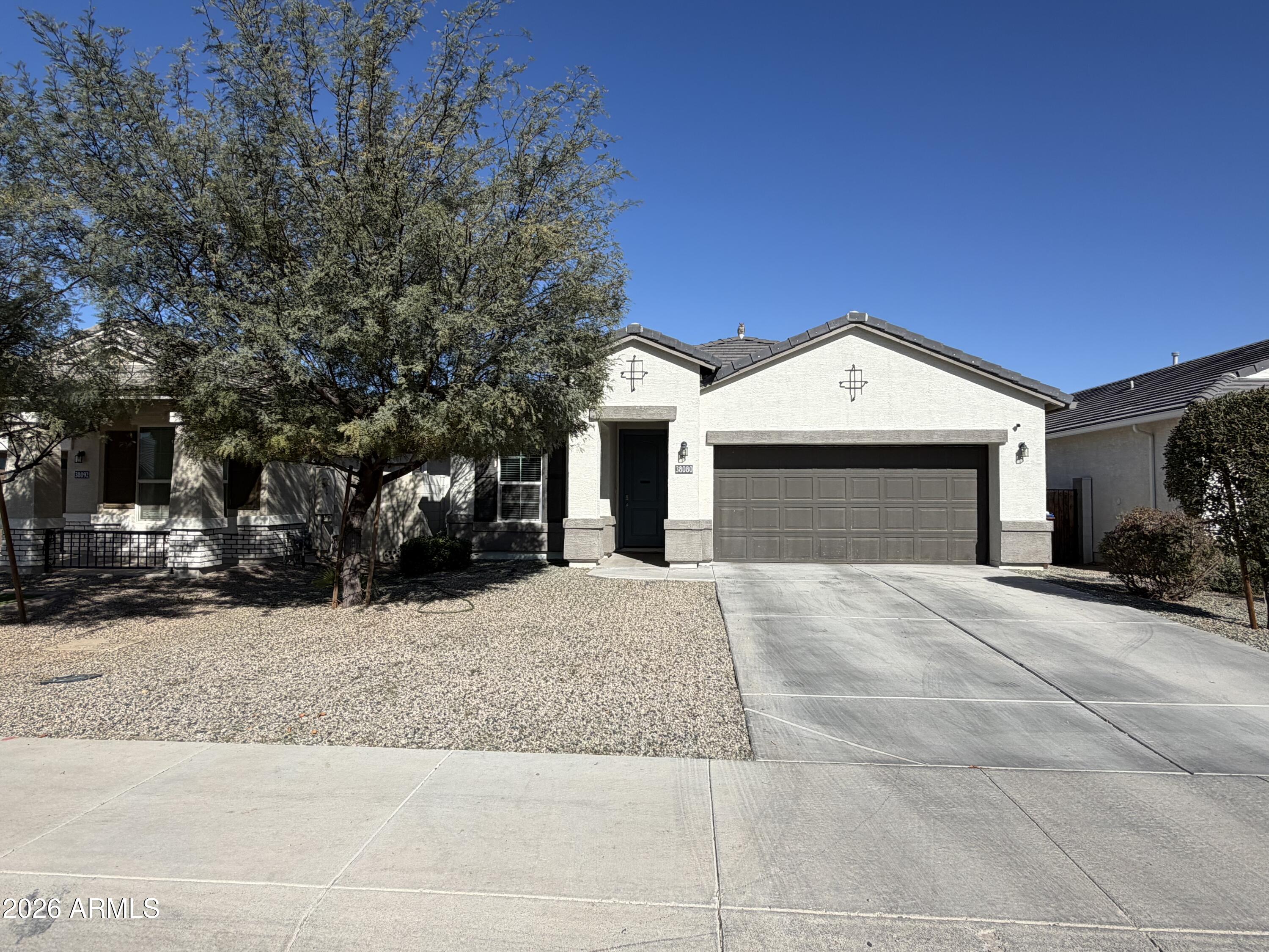 Charming Rancho Mirage Estates Home - Ideal Maricopa Location. This well-maintained single-story ranch home located in Rancho Mirage Estates a sought-after community in central Maricopa. Built by D.R. Horton, these inviting residence features 3 bedrooms and 2 full bathrooms with a thoughtfully designed open floor plan that flows effortlessly from room to room.  Step inside to discover a bright living space with carpet in all the right places and tile in high-traffic areas, creating both comfort and durability for everyday living. The heart of the home is the eat-in kitchen, complete with ample cabinetry, pantry storage, granite countertops, stainless steel appliances, and a generous island with breakfast bar, perfect for meal prep and casual gatherings. The spacious primary suite offers a peaceful retreat with dual sinks and plenty of closet space, while the secondary bedrooms are ideal for family, guests, or a home office. Outdoors, enjoy a covered patio and low-maintenance yard, ready for grilling, relaxing, and entertaining. The 2-car garage and easy-care landscaping add to the home's curb appeal. 
Community living is elevated with neighborhood amenities such as playgrounds and biking/walking paths, providing fun and convenience for families and active lifestyles.