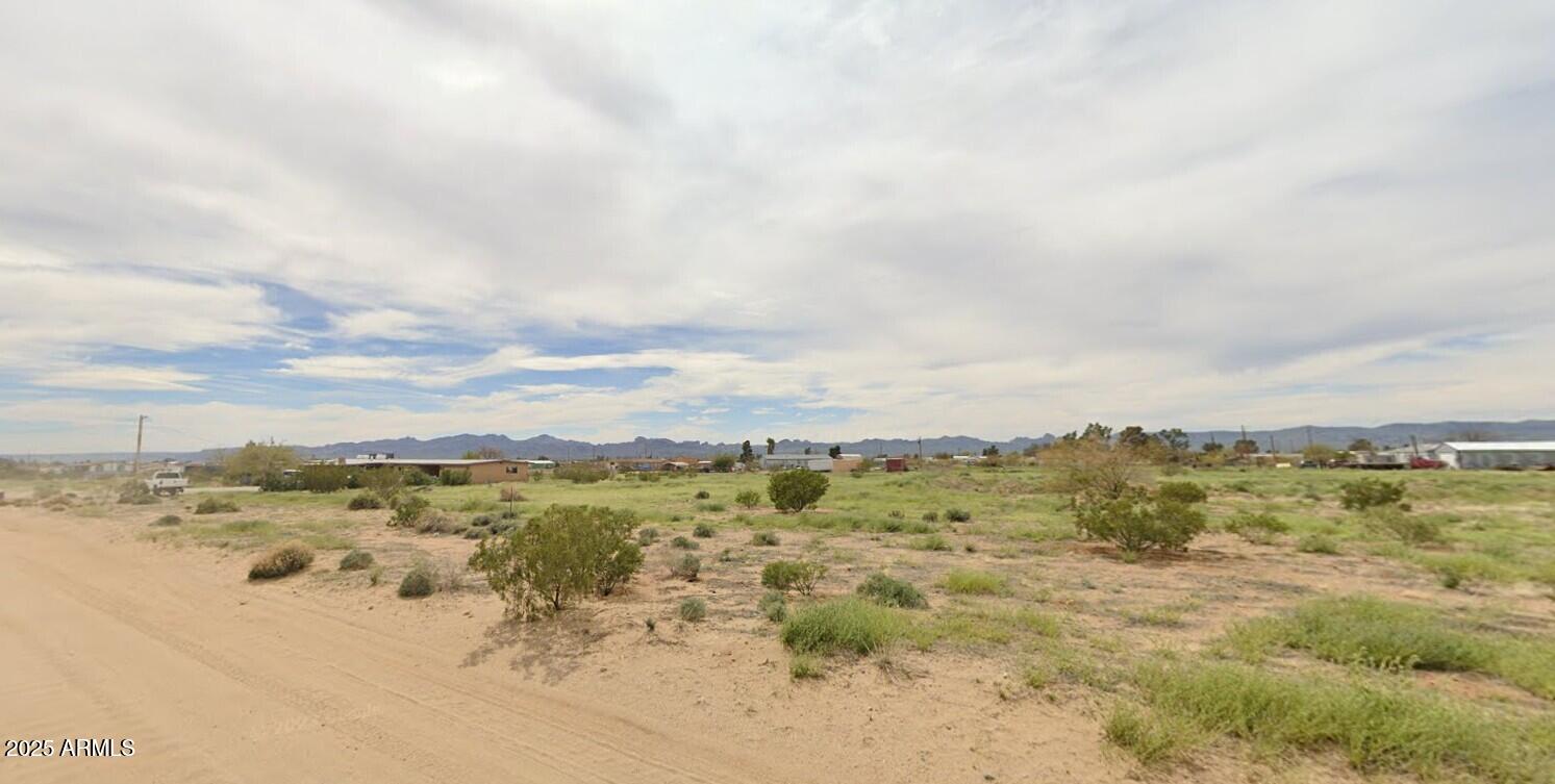 Nice flat lot with water and power available. Use now or later. No timeframe for use. Owner may carry with $9000 down at 8% up to 5 years. Lake Mohave not far for boating, fishing and swimming. Lots of trails nearby for off-roading, horseback riding, mountain biking and hiking. Use for camping now and build later. Lots of possibilities. Drive by and view anytime. Owner/Broker.