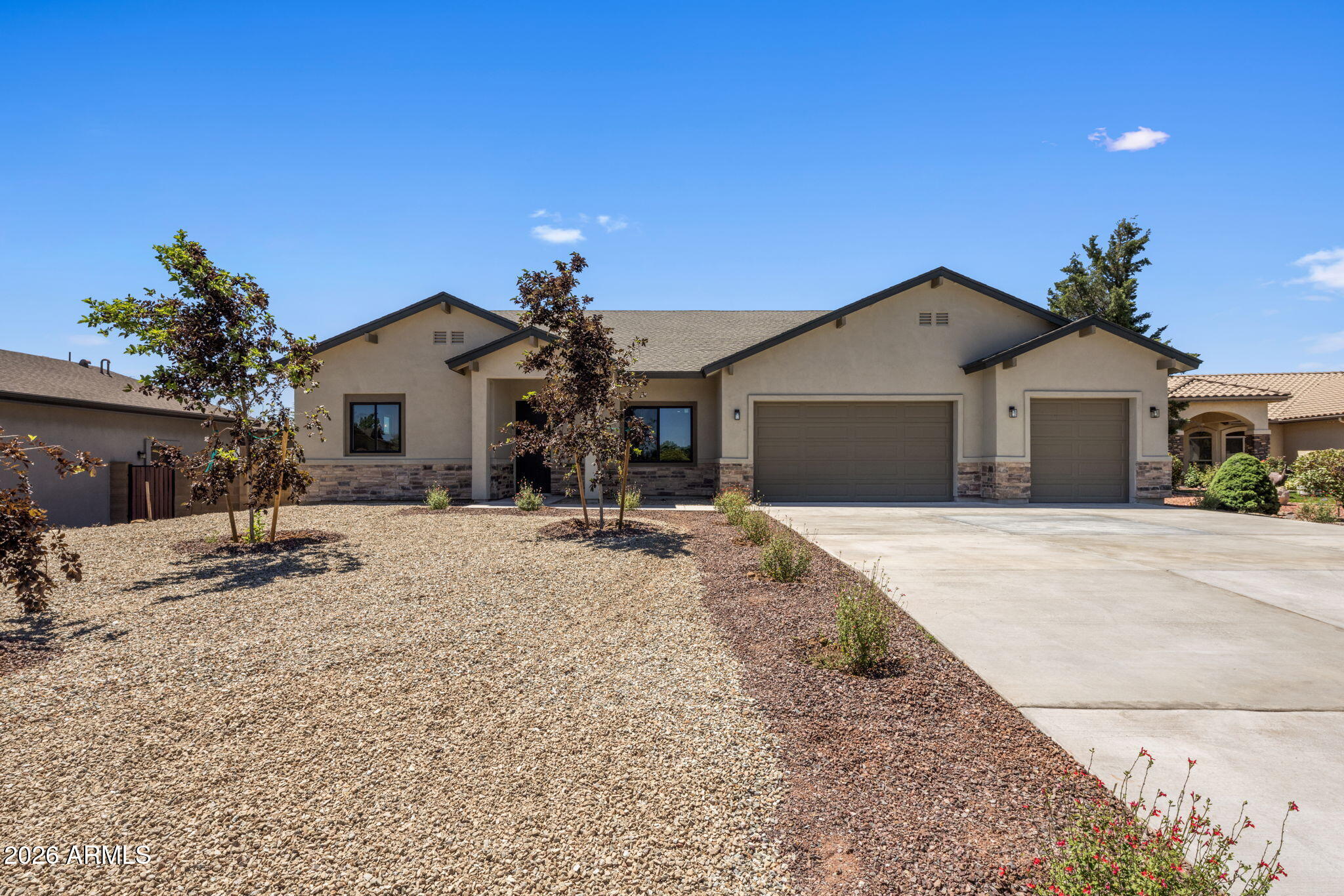 Welcome to Pronghorn Ranch, where comfort and the best of Prescott Valley living come together. This brand-new single-level home offers 4 beds, 3.5 baths, a 3-car garage, & over 2,500 sq ft. The split floor plan features a private primary retreat with backyard access and a spa-inspired bath with soaking tub, glass-enclosed shower, and dual vanities. A junior primary suite on the opposite side of the home is ideal for guests or multigenerational living, while two additional bedrooms share a Jack-and-Jill bath. The open kitchen showcases quartz counters, designer backsplash, gas range, and a large island overlooking the living and dining areas. Enjoy luxury vinyl and tile flooring, a built-in office station, and resort-style amenities including pools, clubhouse, gym, pickleball and trails. Welcome to Pronghorn Ranch, where comfort, connection, and the best of Prescott Valley living come together. This BRAND-NEW CONSTRUCTION single-level home offers over 2,500 sq ft with 4 bedrooms, 3.5 bathrooms, and a 3-car garage. Thoughtfully designed with a split floor plan, the spacious primary suite is tucked away for privacy and features backyard access plus a spa-like bath with a soaking tub, glass-enclosed shower, and dual vanities. On the opposite side of the home, a junior primary suite provides an ideal setup for guests or multigenerational living, while two additional bedrooms are connected by a Jack-and-Jill bathroom. The open-concept kitchen features quartz countertops, designer tile backsplash, gas range, and a large island with breakfast bar seating that flows seamlessly into the dining and living areas. Luxury vinyl plank and tile flooring run throughout, and a built-in office/homework station adds everyday convenience. Located in one of Prescott Valley's most desirable communities, enjoy four mild seasons, nearby shopping, dining, and outdoor recreation, along with resort-style amenities including a clubhouse, heated pools and spas, pickleball, tennis, fitness center, and scenic walking trails. Love where you live.