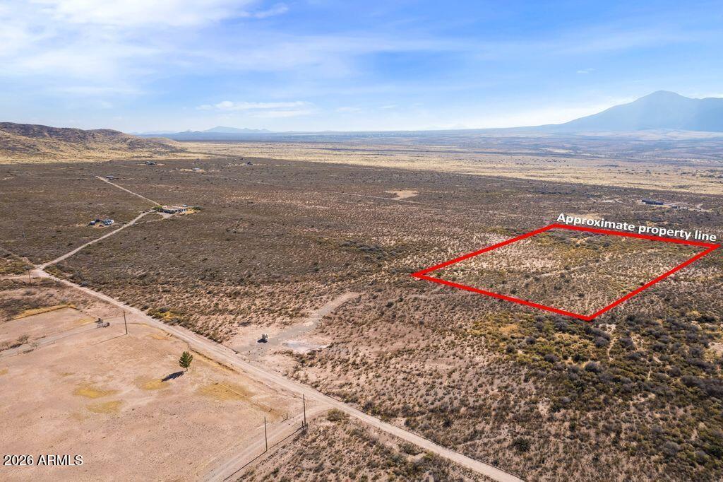 A great parcel of land for Arizona living on this 7.1-acre lot with spectacular mountain views of the Mule and Huachuca Mountains. There is plenty of State, BLM, and National Forest lands to explorer nearby for biking, hiking, and bird watching to name a few activities.. Flexible RU-4 zoning allows for various homes: site-built, manufactured, tiny. barndominium. County zoning allows horses and barn animals. Conveniently located off Highway 92 with a short comminute to the free-spirited vibe of the quaint town of Bisbee. Electricity is on the property line and a new well with amble water has recently been drilled. No HOA or restrictions! Build your dream home or any desired construction on this lot. Opt out building permitted for no permits if desired per Cochise County guidelines.