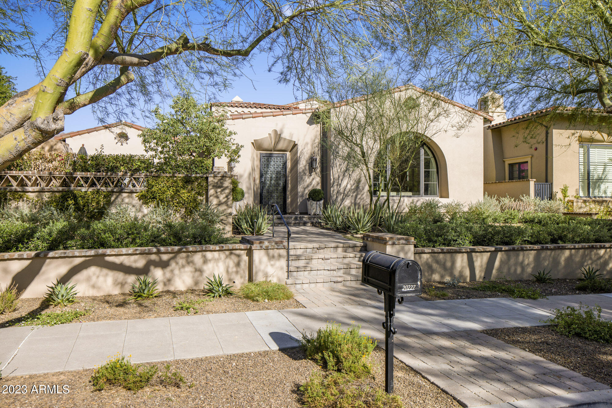 Nestled in the parks of the Silverleaf community near Ethels Garden. This spacious and functional luxurious home was designed by Donna Vallone Interiors, seamlessly blends indoor and outdoor living spaces with contemporary and transitional design elements. Every detail has been thoughtfully considered as it boasts top-tier finishes and appliances, creating elegance, sophistication, and comfort. Upon entering thru the the grand foyer, the charm unfolds with the courtyard featuring an outdoor fireplace, BBQ and pizza oven. Inside, the open concept connects the great room with a fireplace and pocket sliding door, dining room and  gourmet kitchen. The outdoor patio and backyard is a year round oasis with a heated pool, fireplace perfect for entertaining. This home is luxury at its finest.