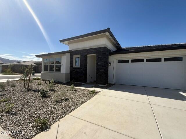 Corner Lot - Check! Mountain Views - Check! This single-story home is a must-see for your next move with 3 large bedrooms with walk-in closets, an expansive great room, extended covered patio and 3 car tandem garage. Live the Arizona indoor and outdoor dream with a large sliding glass door that looks out to an extended patio and large homesite ready for your future pool! This stylish home will feature white cabinets, matte black fixtures and quartz in the kitchen and all bathrooms.  Families will appreciate the location within the award-winning Litchfield Elementary School District, zoned for the brand-new Troy Gilbert Elementary School opening Fall 2026 and the highly rated Canyon View High School. This ultra efficient new home includes 2 x 6 exterior walls and OWNED SOLAR!