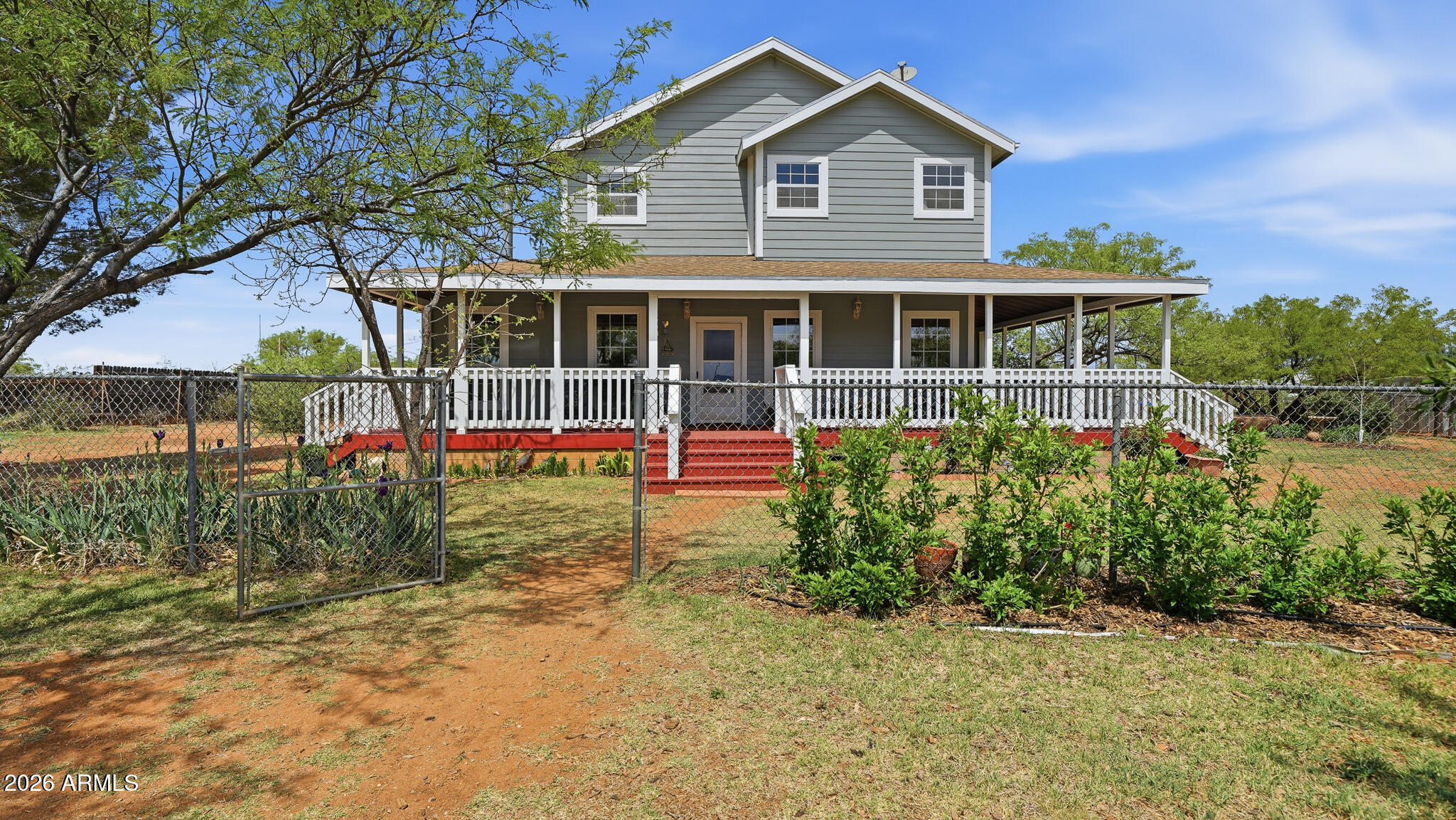 On 4+ acres, this NEWLY RENOVATED farmhouse style home, features a stunning wrap around porch, is any homesteader, gardener, or equine enthusiast's dream! Main floor is an open concept living room, eat in kitchen, and formal dining room. Main floor bdrm has outside entrance, laundry room, full BA and an office. 2nd floor has a large primary bdrm suite with a balcony to see the stunning mountain views! Property includes a 2 bdrm, 1 BA guest house that could be a rental! Has 2 stall barn with workshop, large enough for covered parking, enclosed chicken run. Has round pen, 2 RV hook ups, 25+ shade/fruit trees, irrigated/enclosed garden, green house, irrigated area for large crops, grapes w/lovely arbor, 90% of landscaping is on watering system. Too many new renovations to list! A MUST SEE! Features stunning views of the Huachuca Mountains and located less than 20 miles of Fort Huachuca. Ask your agent for the complete, very long list if additions and renovations.