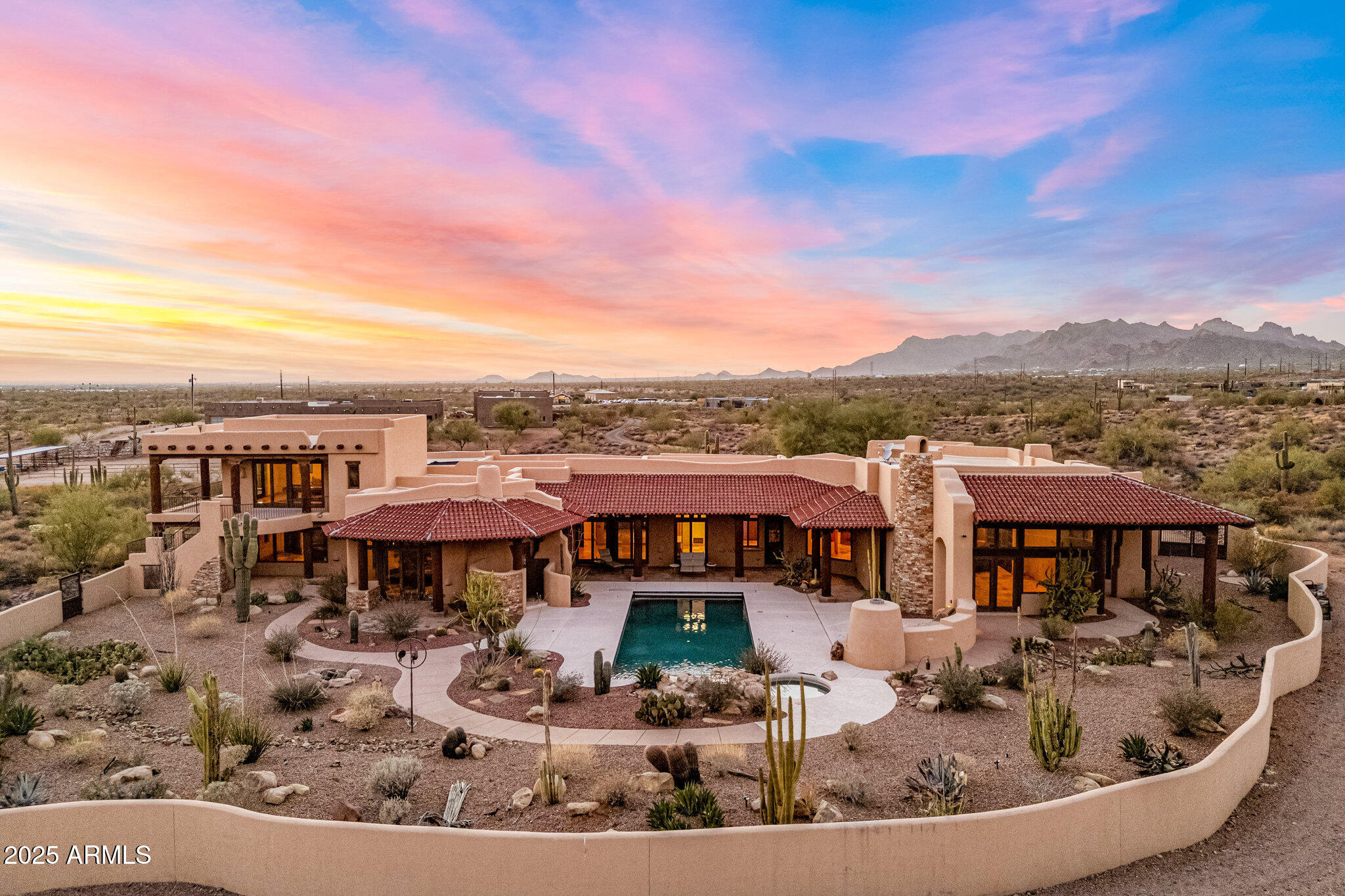Rare opportunity to own a one of a kind property or future venue for limitless possibilities! Enjoy magnificent unobstructed Superstition Mountain views from this stunning custom built one of a kind home! This estate sprawls 7.44 acres adjacent to State and BLM land offering a rare combination of privacy, breathtaking mountain views and direct access to the Superstition Mountain Wilderness Area's endless trails. Every element of this property showcases exceptional architectural design and craftmanship throughout with meticulous attention to detail.  This 6753 square-foot home provides abundant living and storage space with large windows, skylights, and overhead lighting filling the home with natural light.