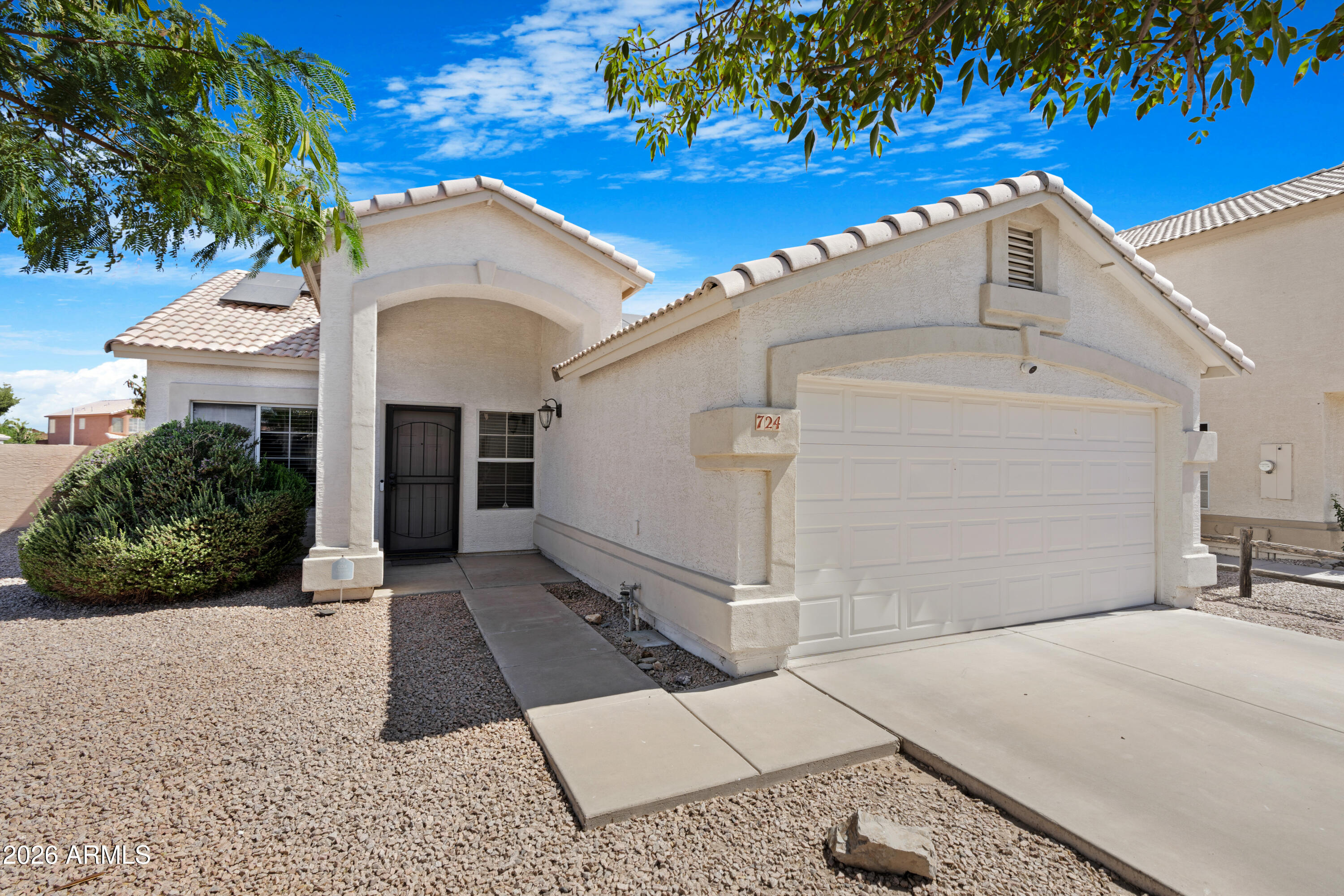 Beautifully maintained 3 bedroom, 2 bath home situated on a desirable corner lot offering 1,420 SqFt with separate living/dining and family rooms. The eat-in kitchen features oak cabinetry, stainless steel appliances, pantry, dual-height island with breakfast bar, and newly installed stove and oven. Sliding glass doors lead to the spacious backyard complete with an extended paver patio, RV gate, and a NEW flat patio roof completed in 2026--perfect for outdoor entertaining. The primary suite includes a private bath with dual sink vanity, tub/shower combo, and walk-in closet. Recent upgrades include NEW bedroom flooring, exterior paint, and owned solar installed in 2020 for energy efficiency. Additional features include vaulted ceilings throughout, 2-car garage and access to a community park with playground and sport court. Located in highly rated Chandler schools and close to shopping, dining, parks, and entertainment. This move-in ready home has been thoughtfully updated and is a must-see!