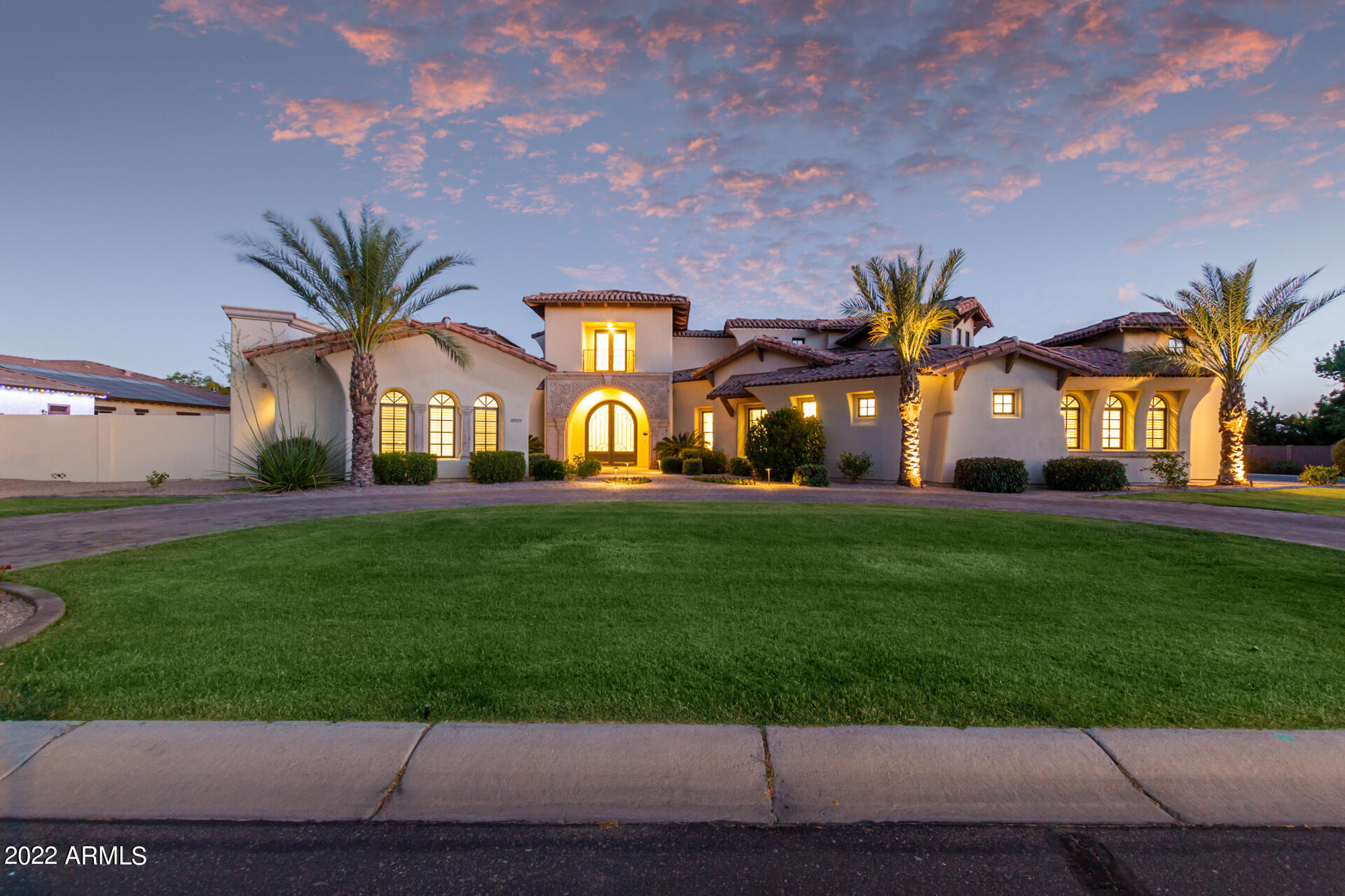 Luxurious custom home, which sits on a spacious corner lot located in Weston Ranch, one of Gilbert's finest gated communities! Meticulous Craftsmanship, Thoughtful Design, and Beautiful Interior Architecture. The kitchen features Quartz countertops, double islands, a Thermador 6 Burner Range, two Thermador refrigerators, a Thermador Freezer,,  two dishwashers, Burdette Cabinets, a wine refrigerator, a warming drawer,  and a Scotsman Sonic ice maker. Additional features include Italian Calacatta marble in Master bath, Sierra Pacific Wood Clad windows, ground mounted, inconspicuous, 20kw Solar System that results in minimal utility cost, guest quarters w/ ingress and egress, closets by Classy Closets, wood floors, dual washer/dryer,  circular drive, and an air conditioned storage space in the garage. Entertain or relax in a your personal private resort. The back yard is sure to impress with a covered patio, built-in BBQ, large ramada, stand-alone fire-feature, and perfectly manicured landscape.  The heated swimming pool has a rope swing, jumping platform, swim thru gratto, and resistance jets which can be used for water aerobics and therapeutic exercise.