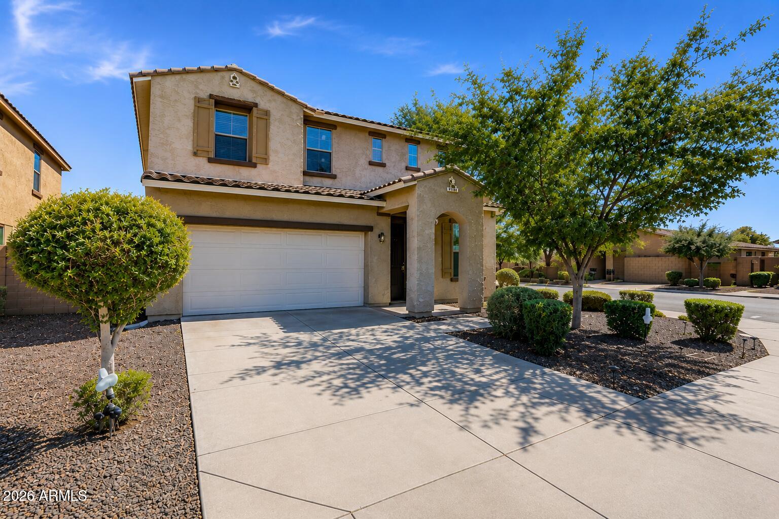 Beautifully maintained corner-lot home in desirable Gilbert Commons Enclave with no back neighbors! Built in 2014, this spacious home features an open-concept floor plan, a stunning kitchen with granite countertops, a large island, stainless steel appliances, and rich espresso cabinetry. Upstairs offers a versatile loft, generously sized bedrooms, and a spacious primary suite with a large walk-in closet. Three full bathrooms provide added convenience for family and guests. Enjoy the oversized backyard with room to create your dream outdoor space. New A/C installed in 2022. Community parks, shopping, dining, Fry's Marketplace, and Chandler-Gilbert Community College are all just minutes away. Move-in ready!