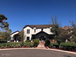 This beautiful ESTATE HOME is located in the heart of Arcadia at the end of cul de sac with great views of CAMELBACK MOUNTAIN . Custom built with the finest attention to detail / finishes, the home features a split floor plan with 6 bedrooms en-suite/9 baths all on main level.Bonus room on kids side. Amazing Master Suite with fireplace,sitting area,, views, 275 sft closet &multi-function steam shower, Only room on second level is a large loft. Guest casita w private bath and garage. Gourmet kitchen w Wolf appliances adjacent to large family room w 29 ft ceilings  disappearing glass wall that opens to a resort like yard, heated pool and spa, large grass area and magnificent privacy and views.Smart home technolog T/O,  climate controlled wine cellar, 2laundry rooms,A MUST SEE HOME.